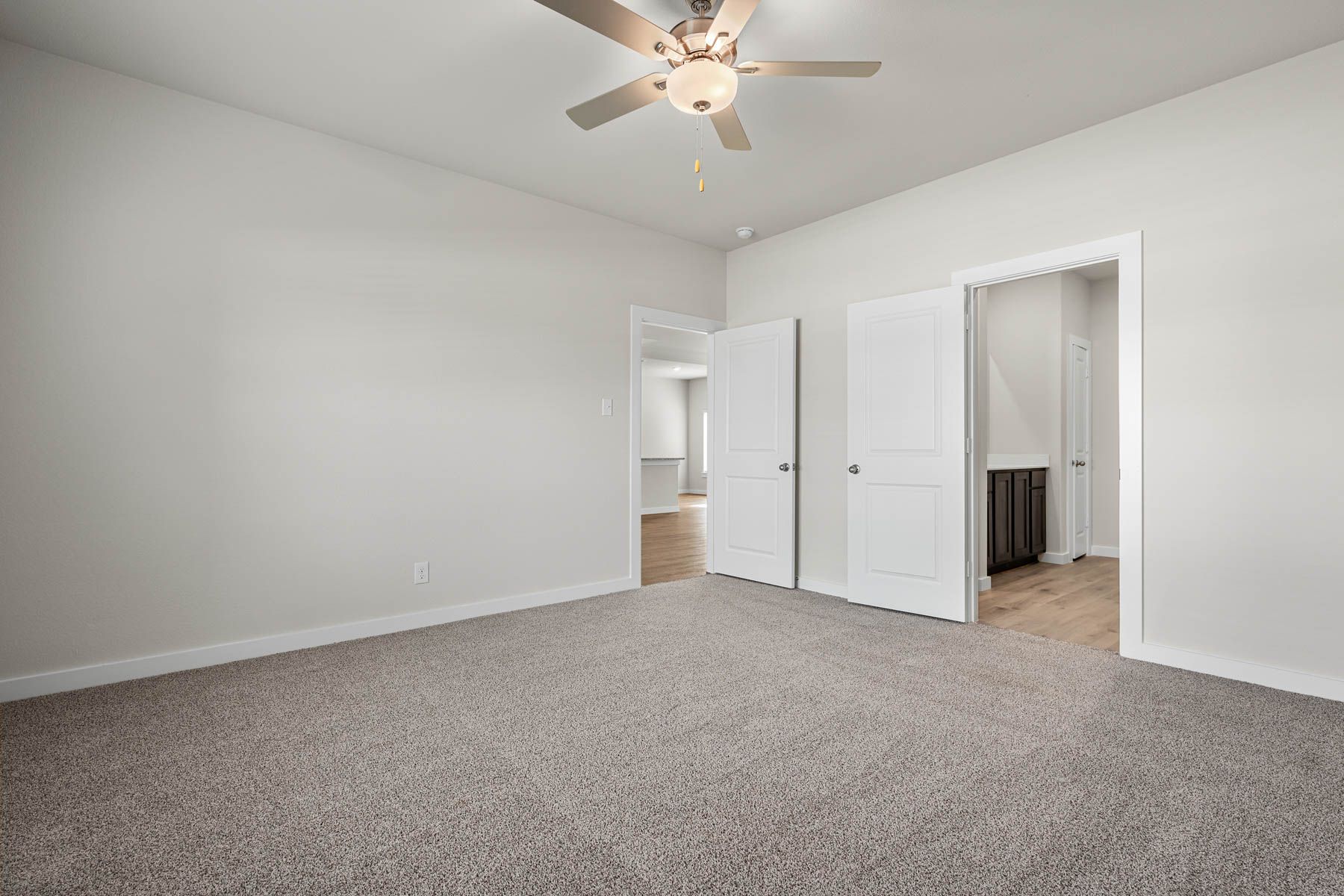 The master suite has a large bedroom, ensuite bathroom and a walk-in closet.