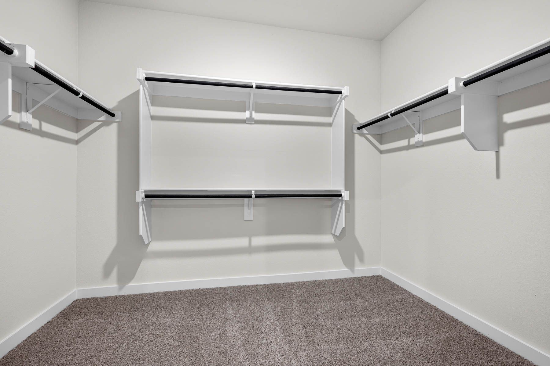 The master walk-in closet has plenty of hanging space and shelves for all of your clothes and belongings.