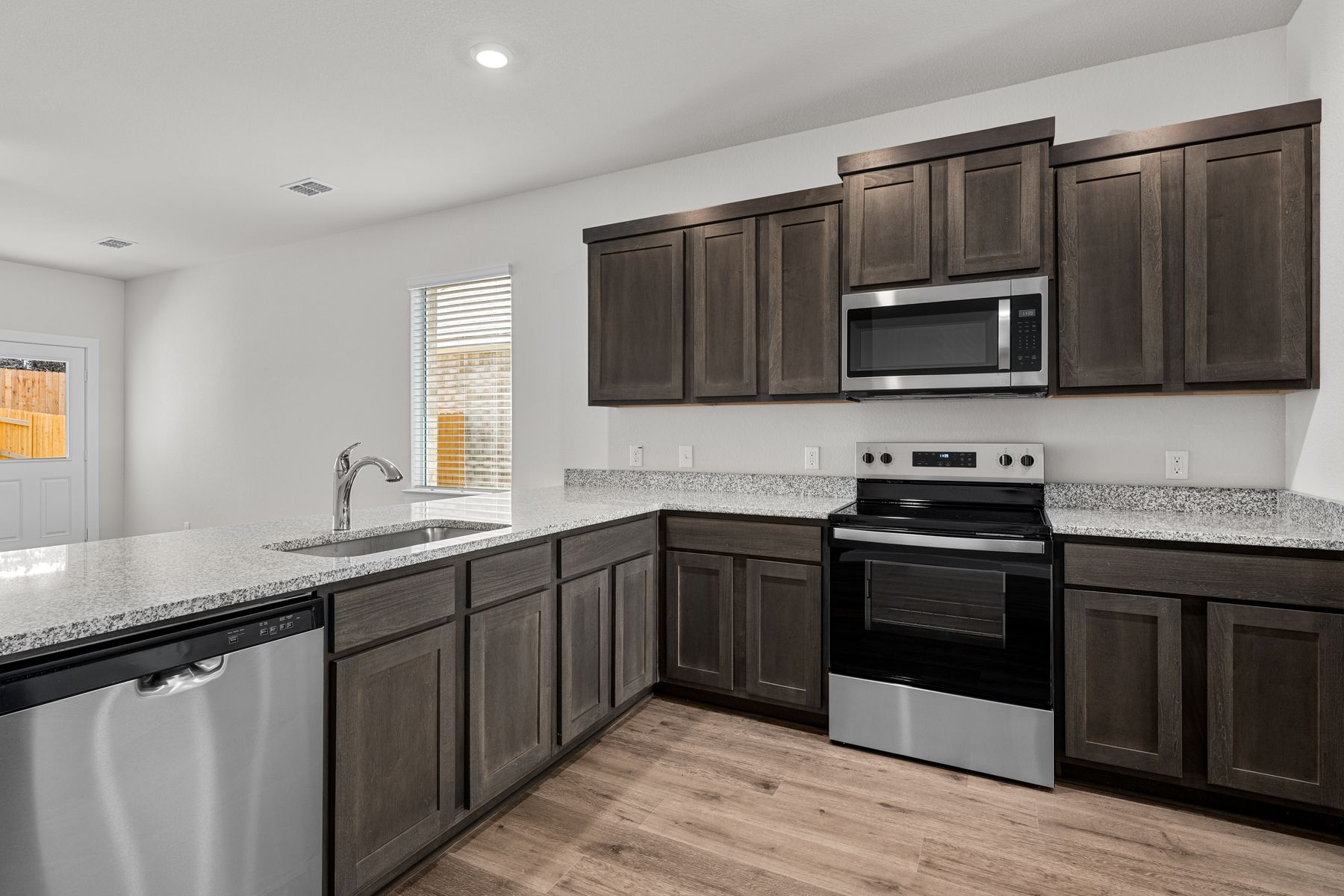 The kitchen has a wonderful breakfast bar.