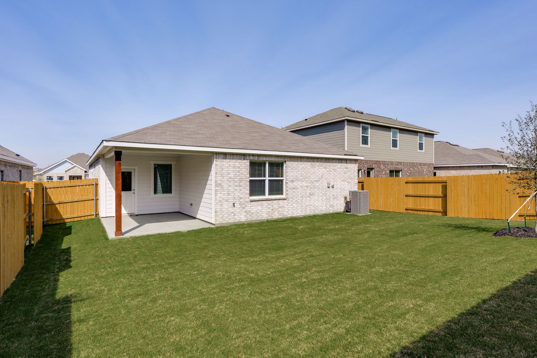 The back yard is fully fenced in.