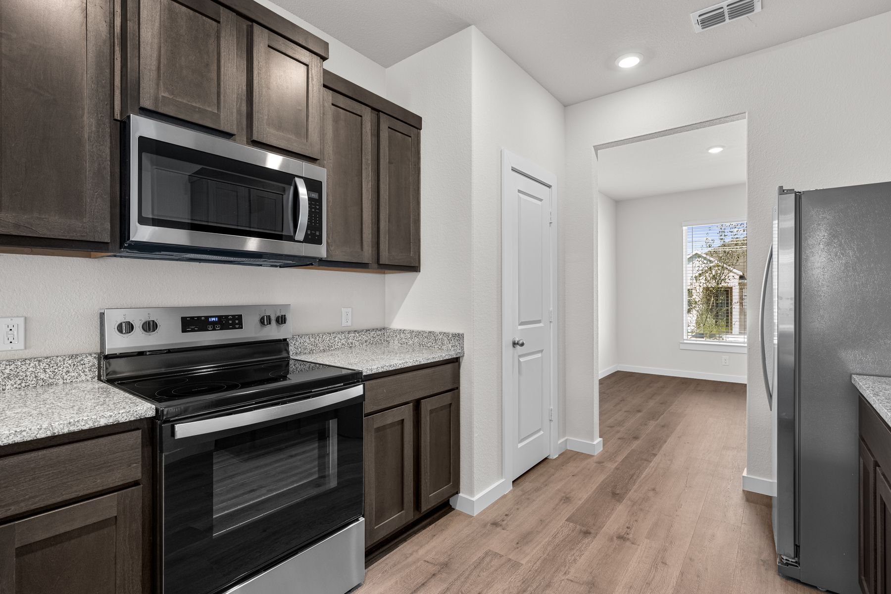 The kitchen has sprawling granite countertops.