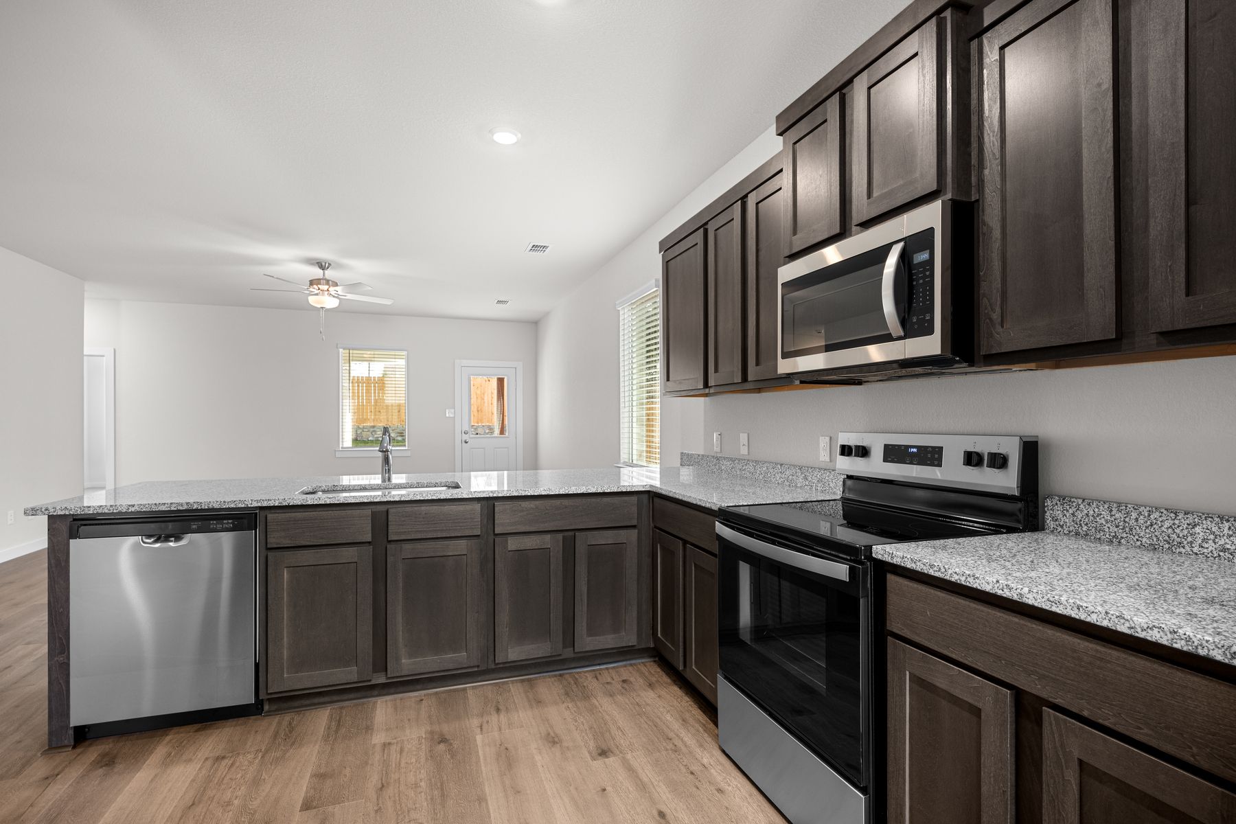 The kitchen has beautiful wood cabinetry.