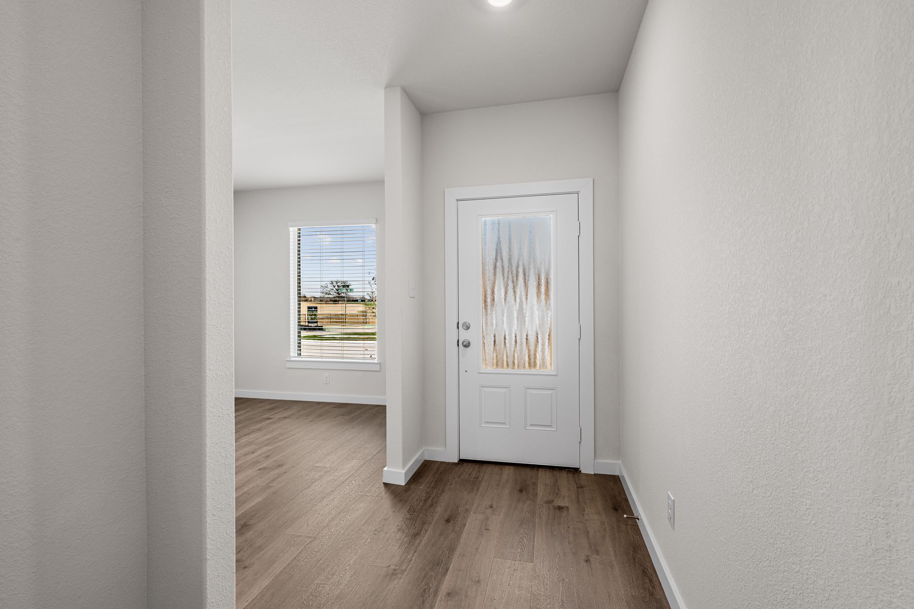 The dining room sits off of the welcoming foyer.