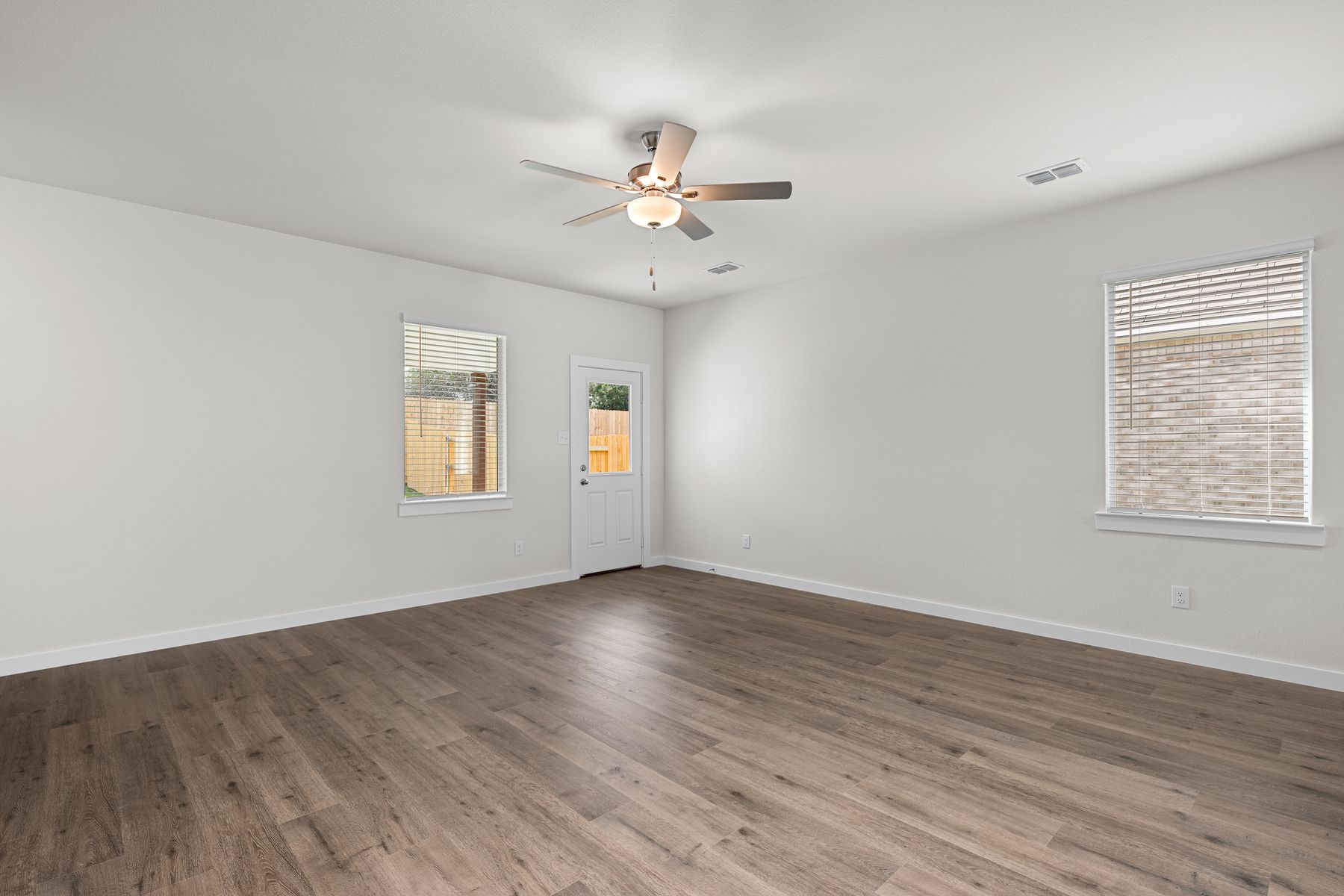 The living room has a large window that lets in great, natural light.
