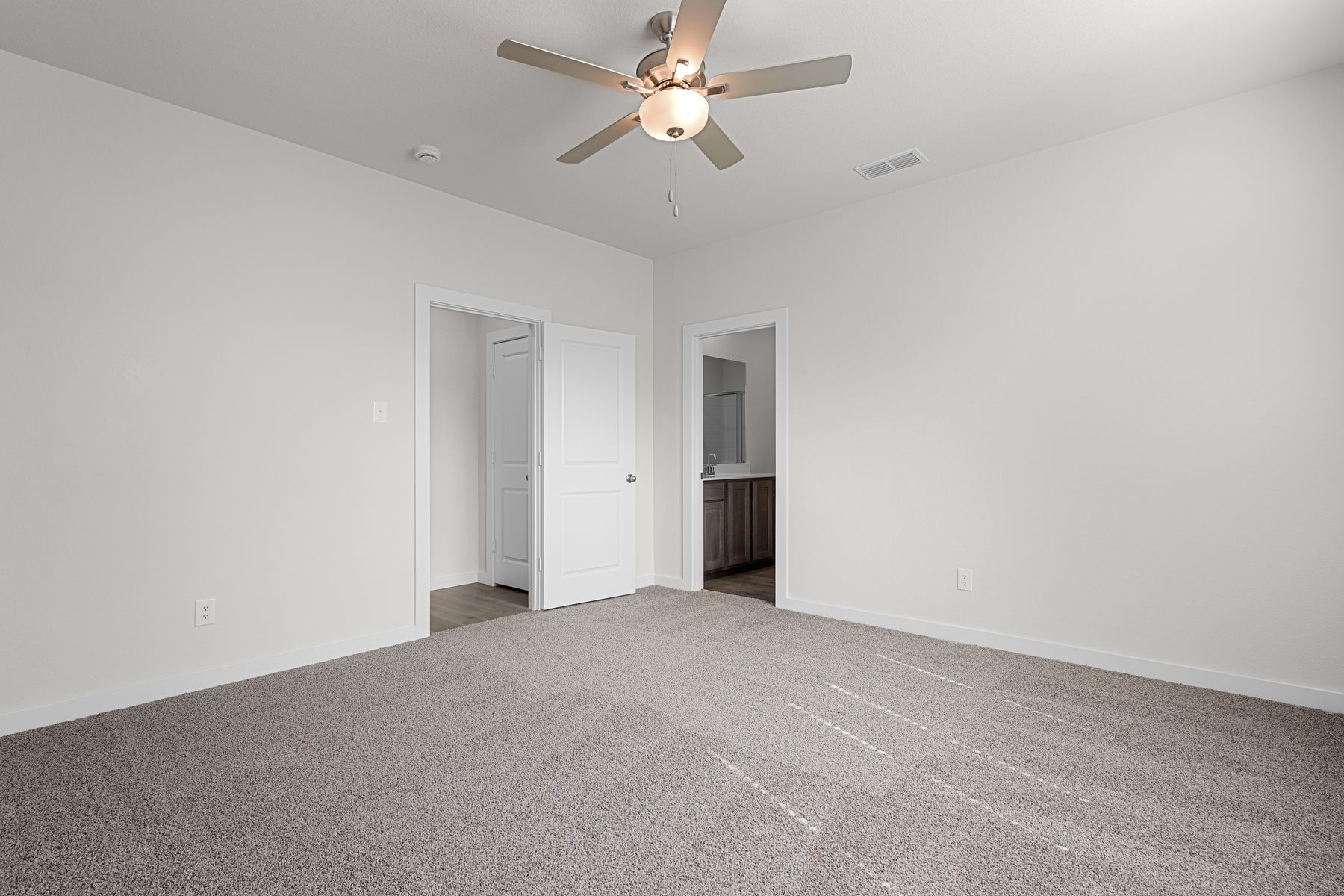 The master suite has a large bedroom, ensuite bathroom and a walk-in closet.