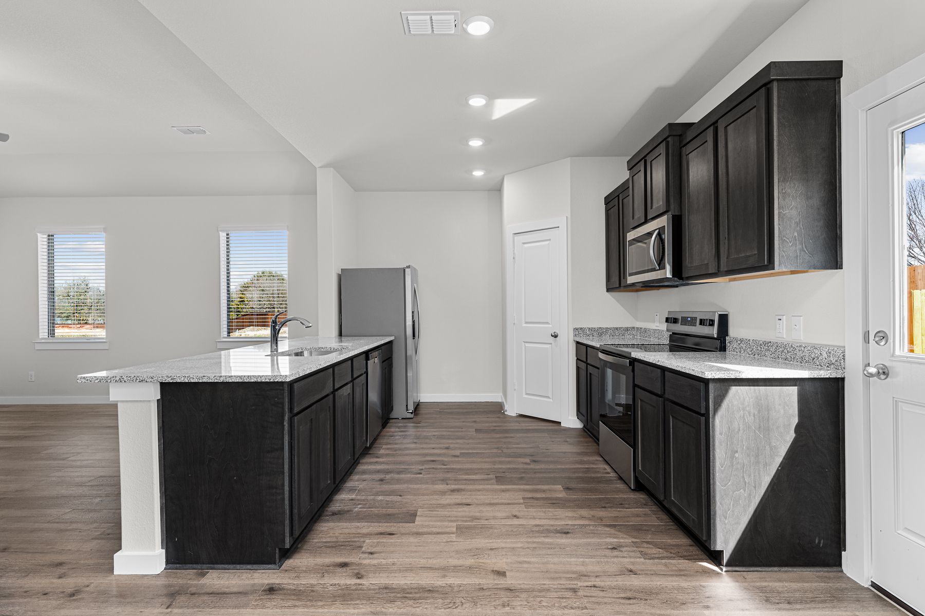 The kitchen has beautiful wood cabinetry.