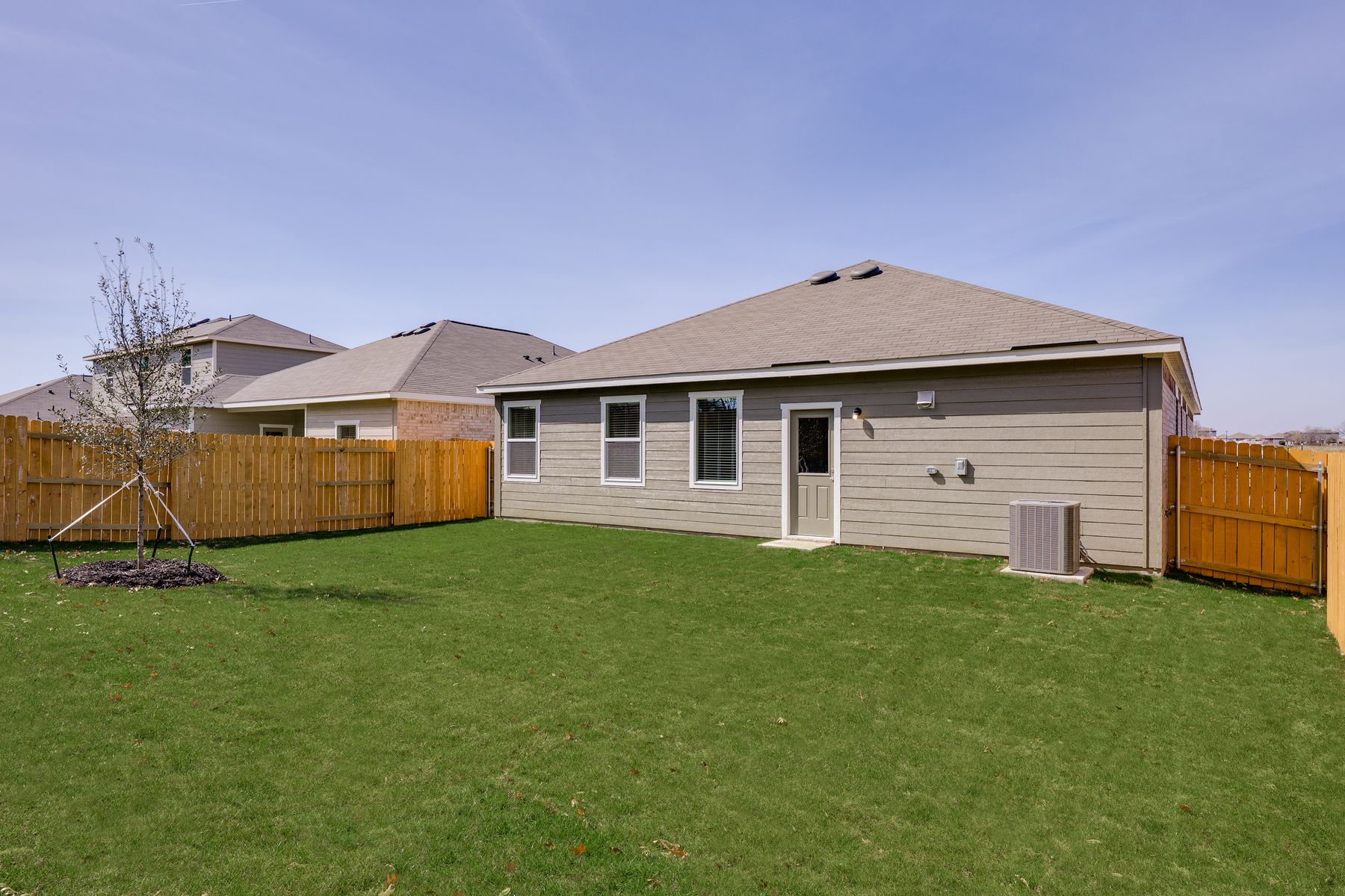 The back yard is fully fenced in.