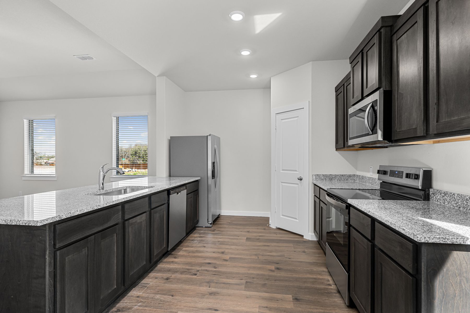 The kitchen has stainless-steel, energy-efficient appliances.