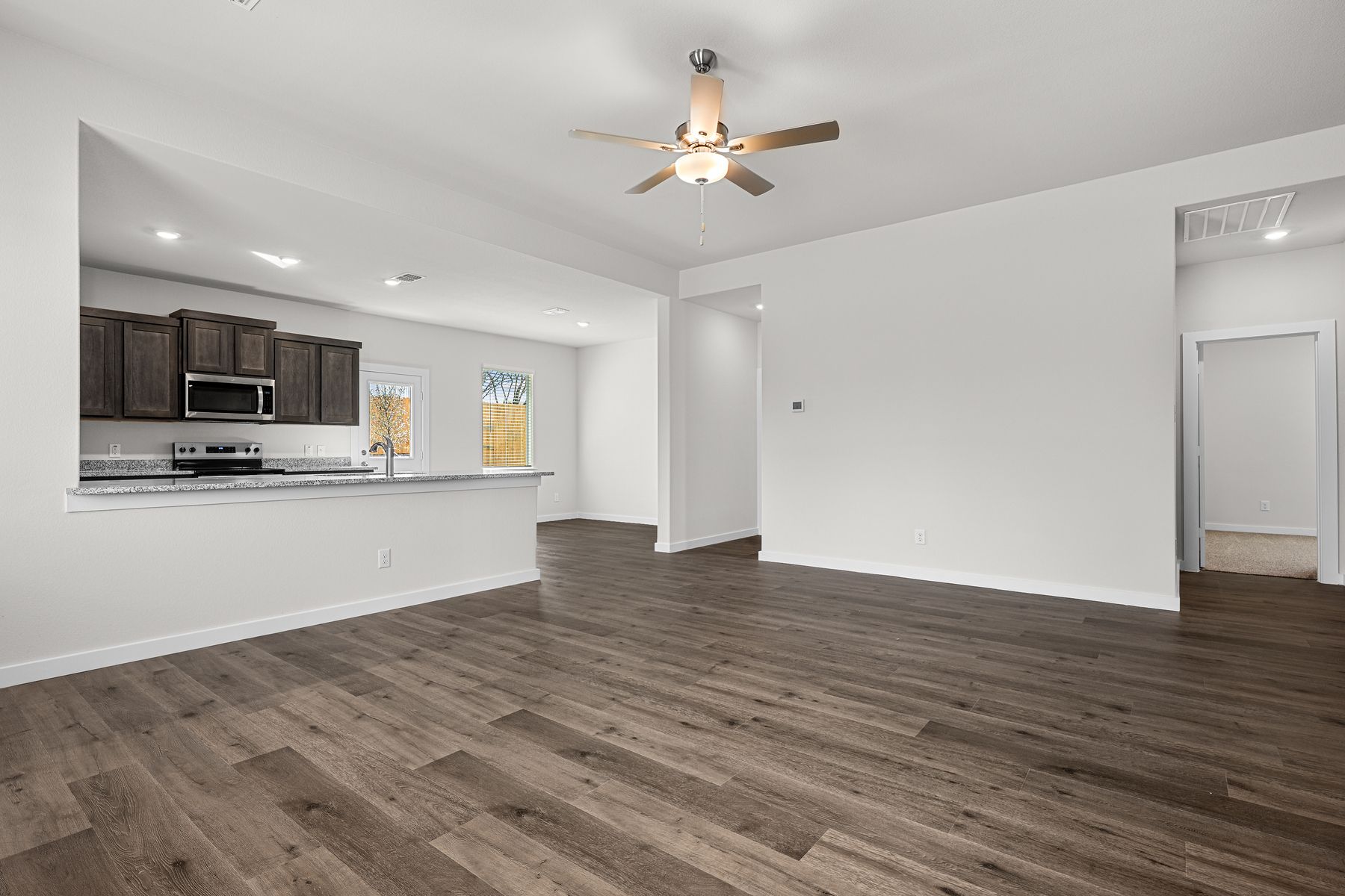 The living room sits right off of the kitchen and dining room.