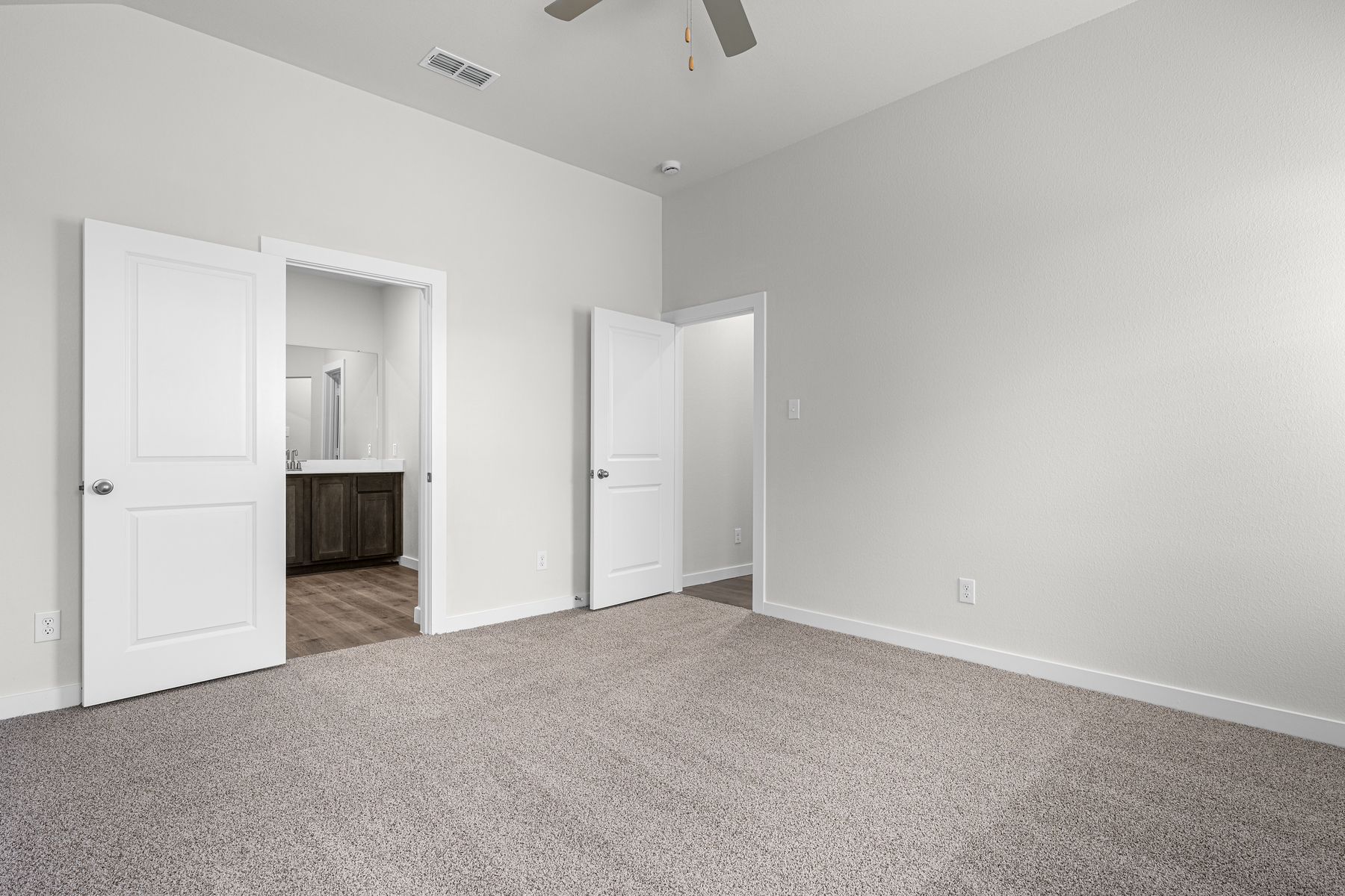 The master suite has a large bedroom, ensuite bathroom and a walk-in closet.