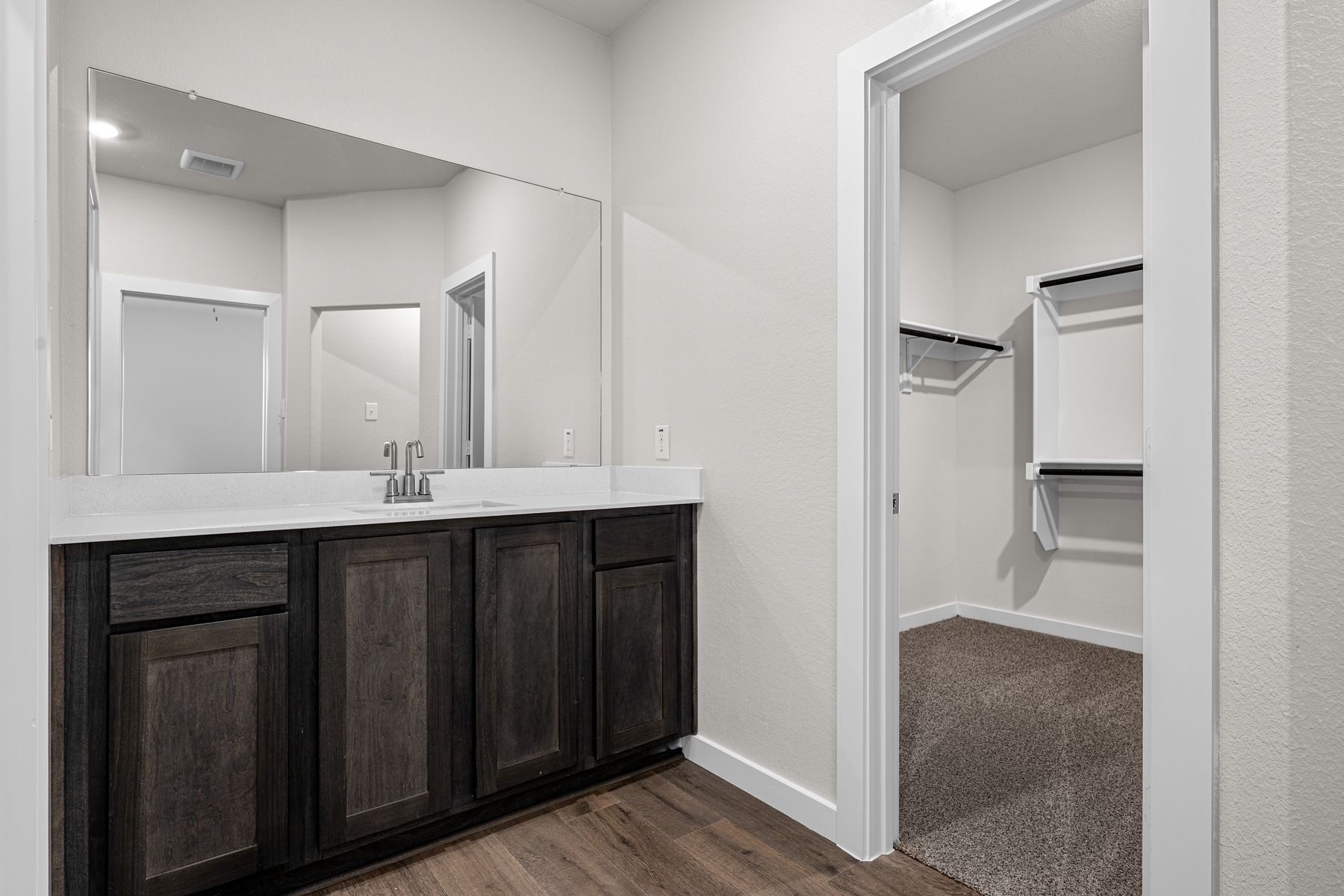 The master bathroom has a sprawling vanity.