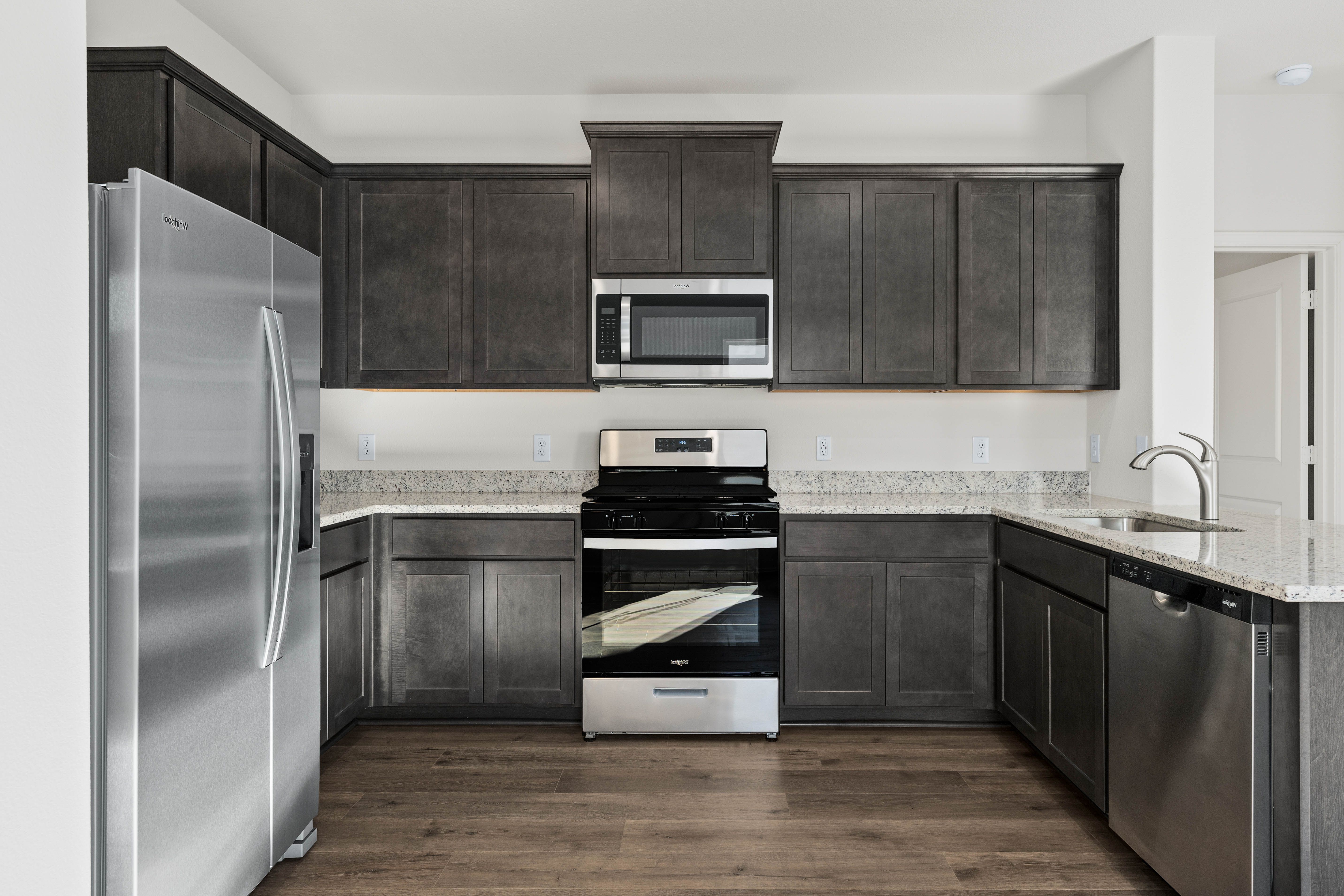 The kitchen has energy-efficient, stainless-steel appliances.