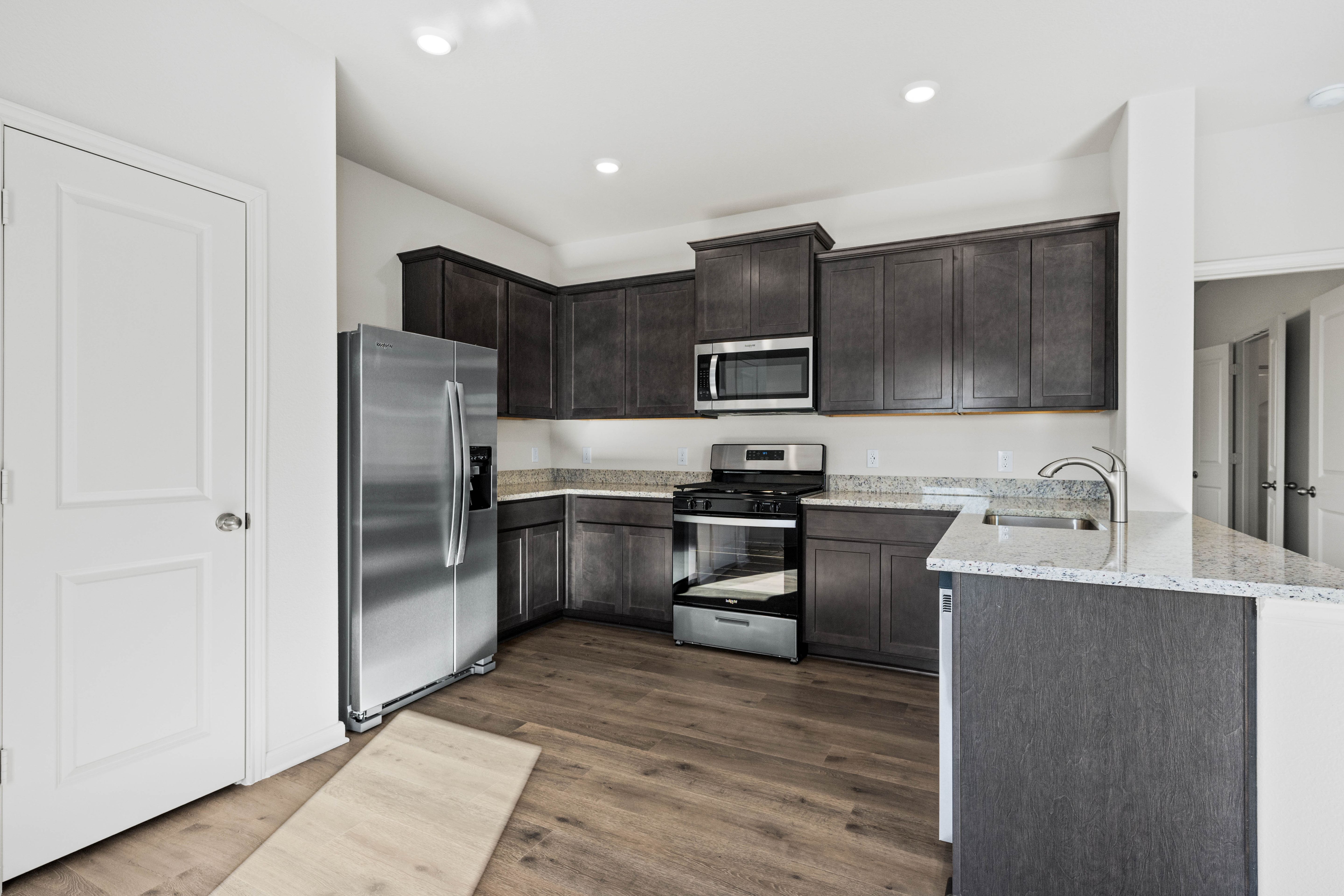 The kitchen has beautiful wood cabinets.