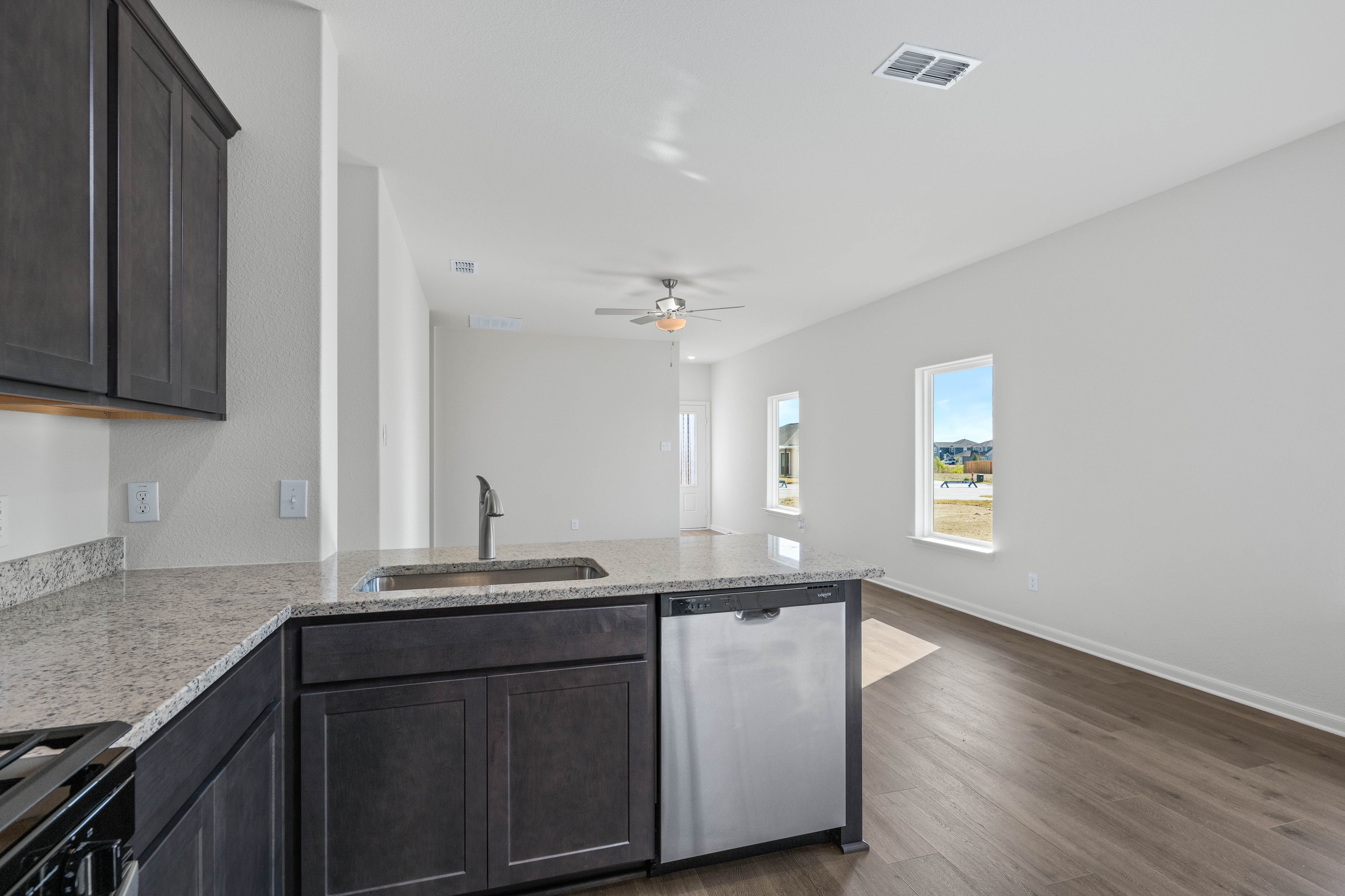 The kitchen looks out at the family room.
