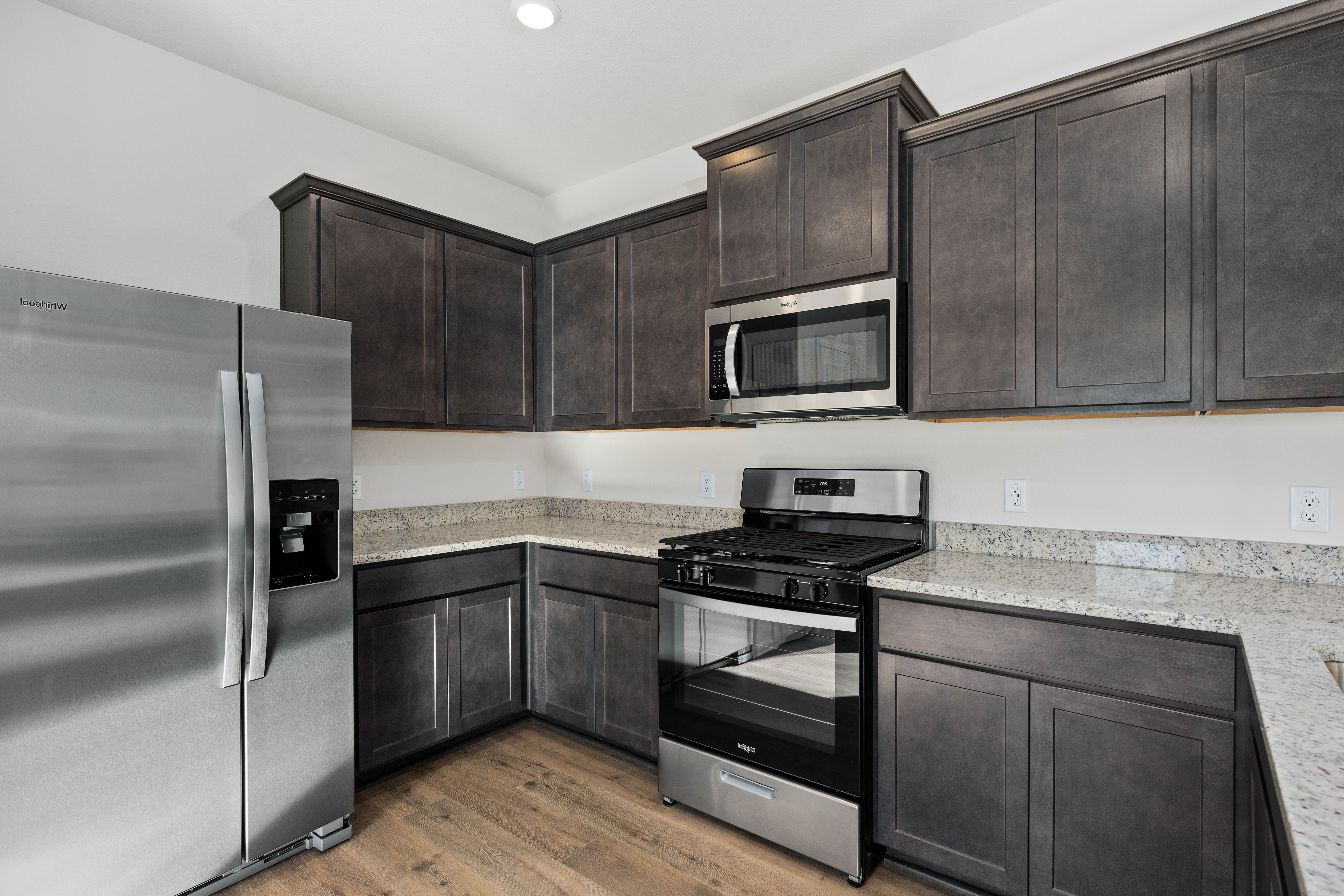 The kitchen has sprawling granite countertops.