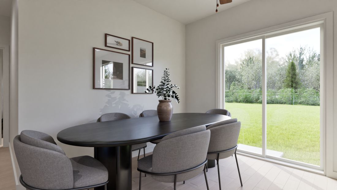 The dining room is spacious and open to the back yard.