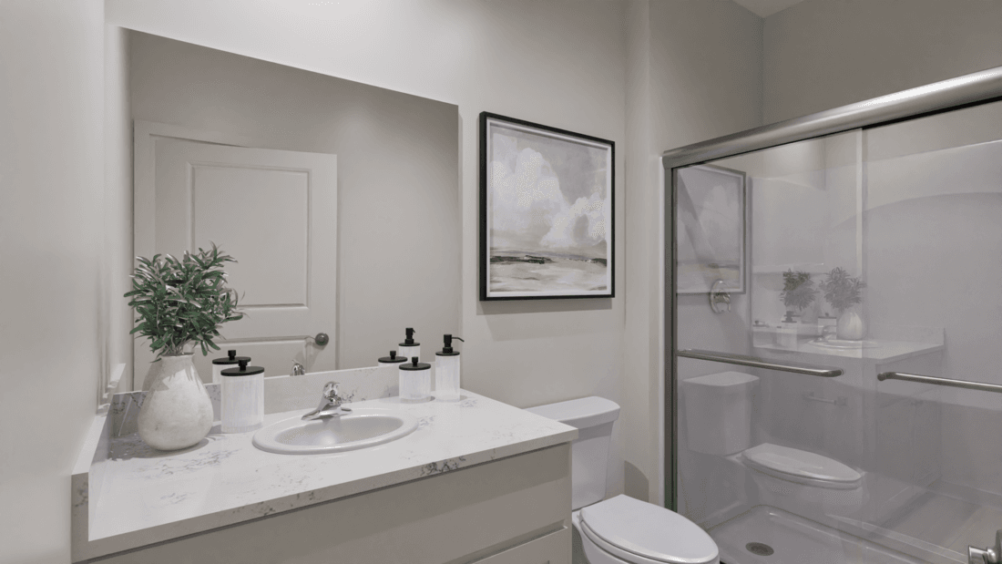 The master bedroom has a large vanity and a step in shower.