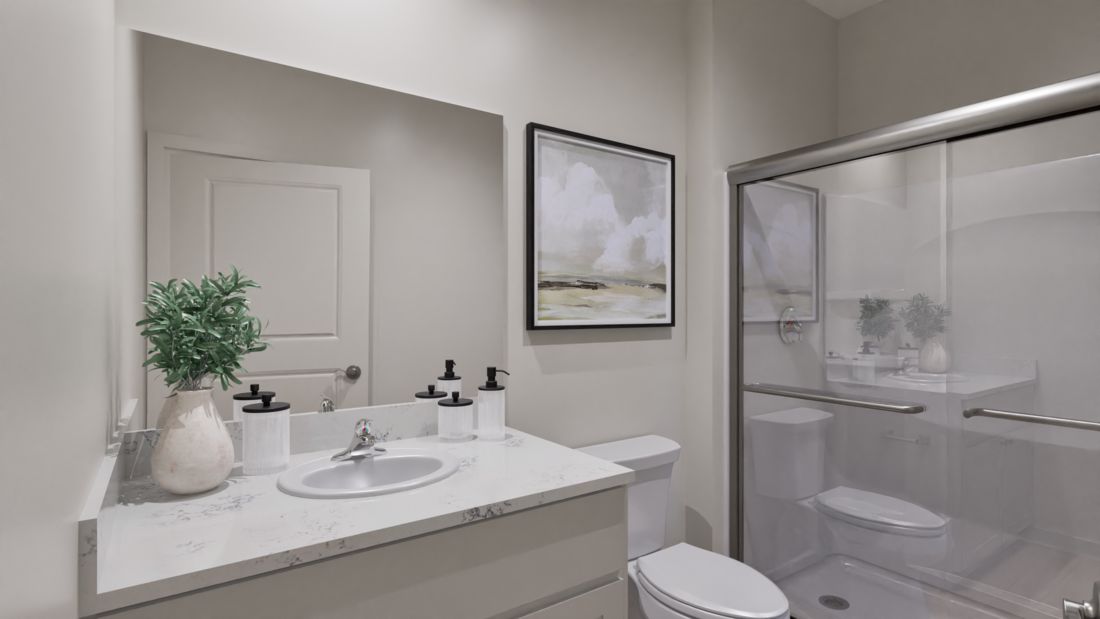 The master bedroom has a large vanity and a step in shower.