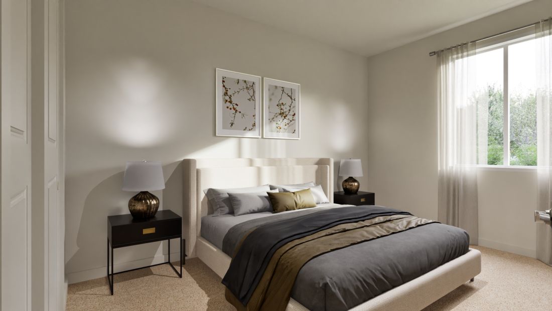 The master bedroom is spacious with a large window.