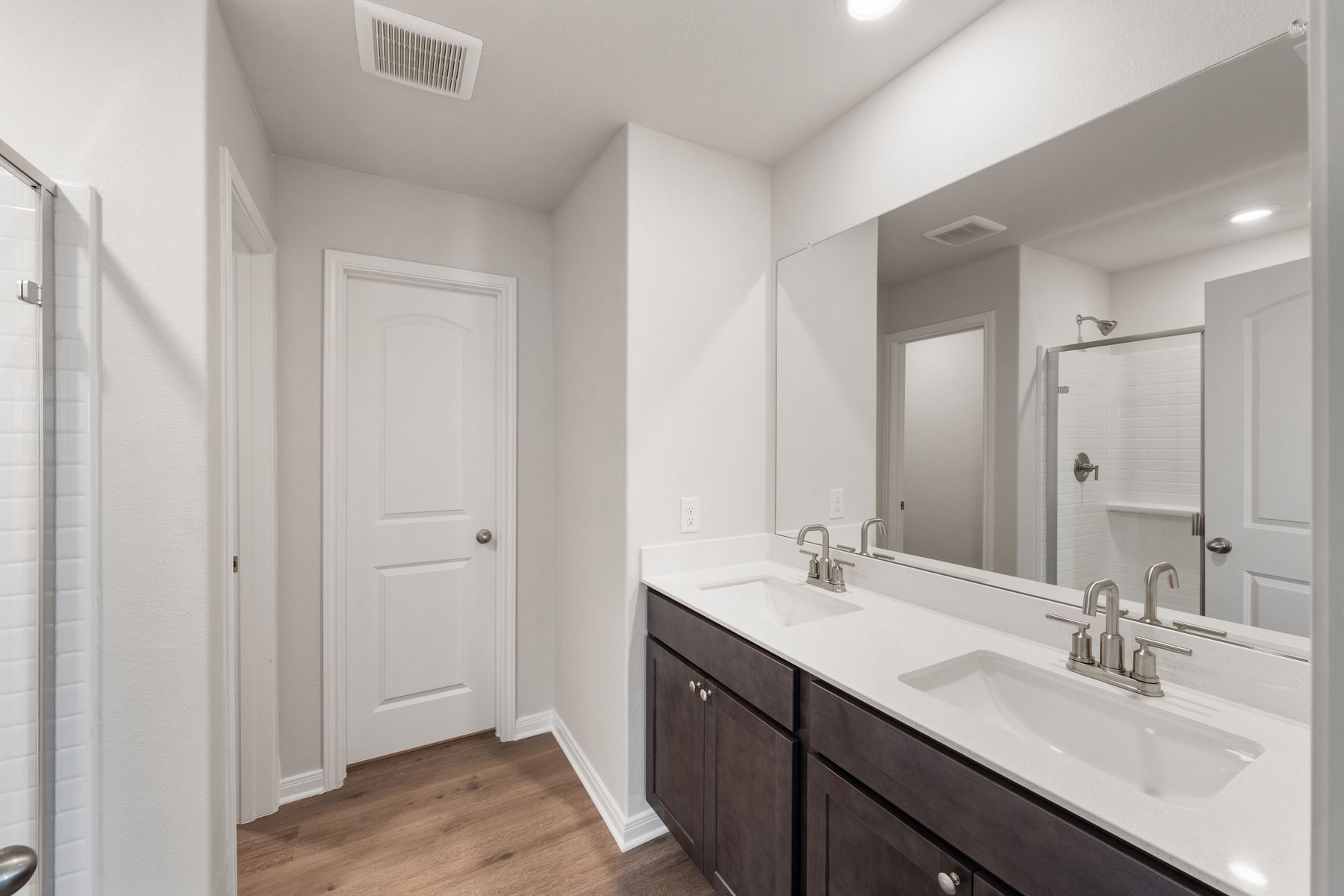 The master bathroom has a sprawling dual-sink vanity.
