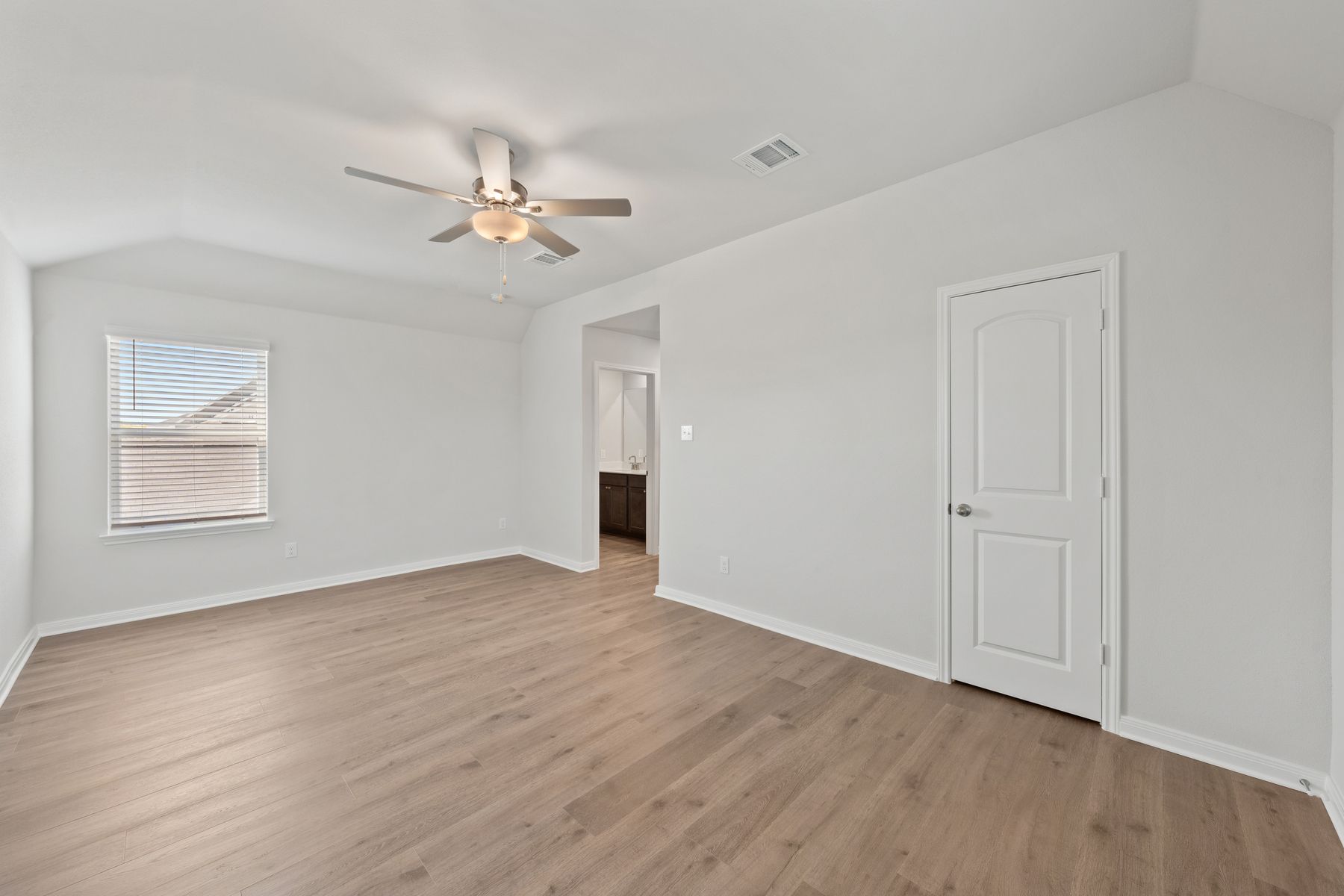 The master suite has a large bedroom, ensuite bathroom and walk-in closet.