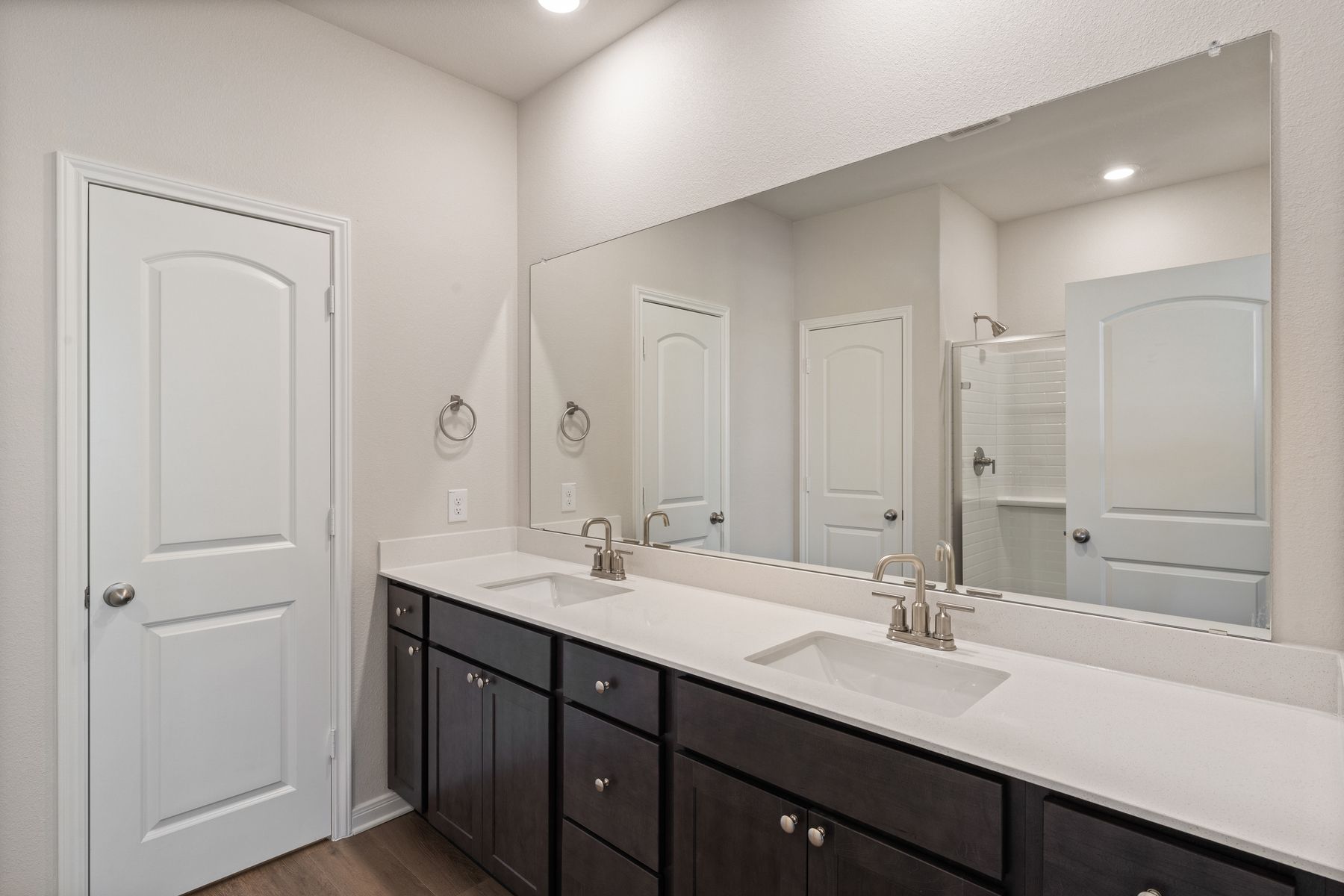 The master bathroom has a sprawling dual-sink vanity.