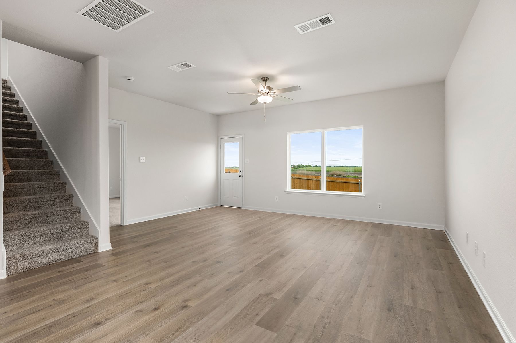 The living room is spacious and sits right off of the dining area.