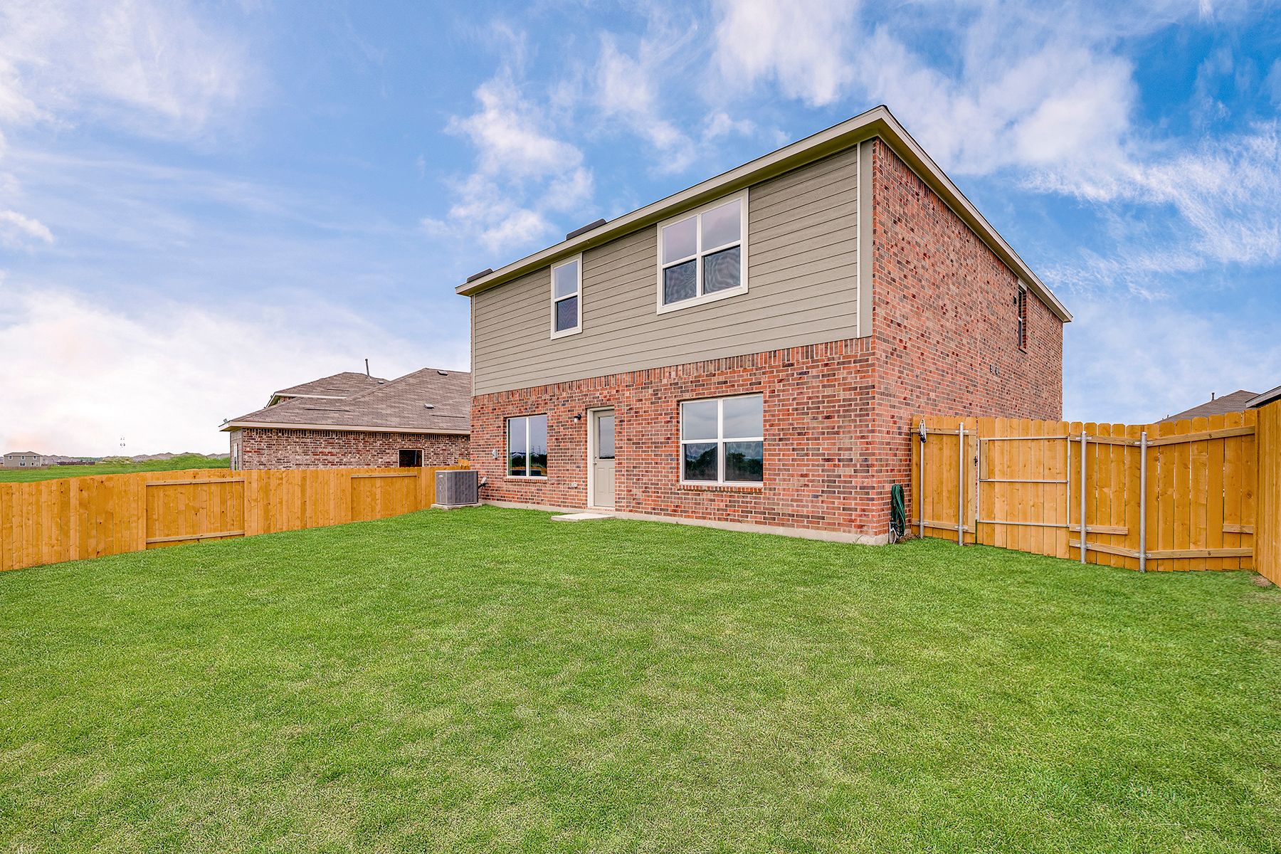 The back yard is fully fenced.