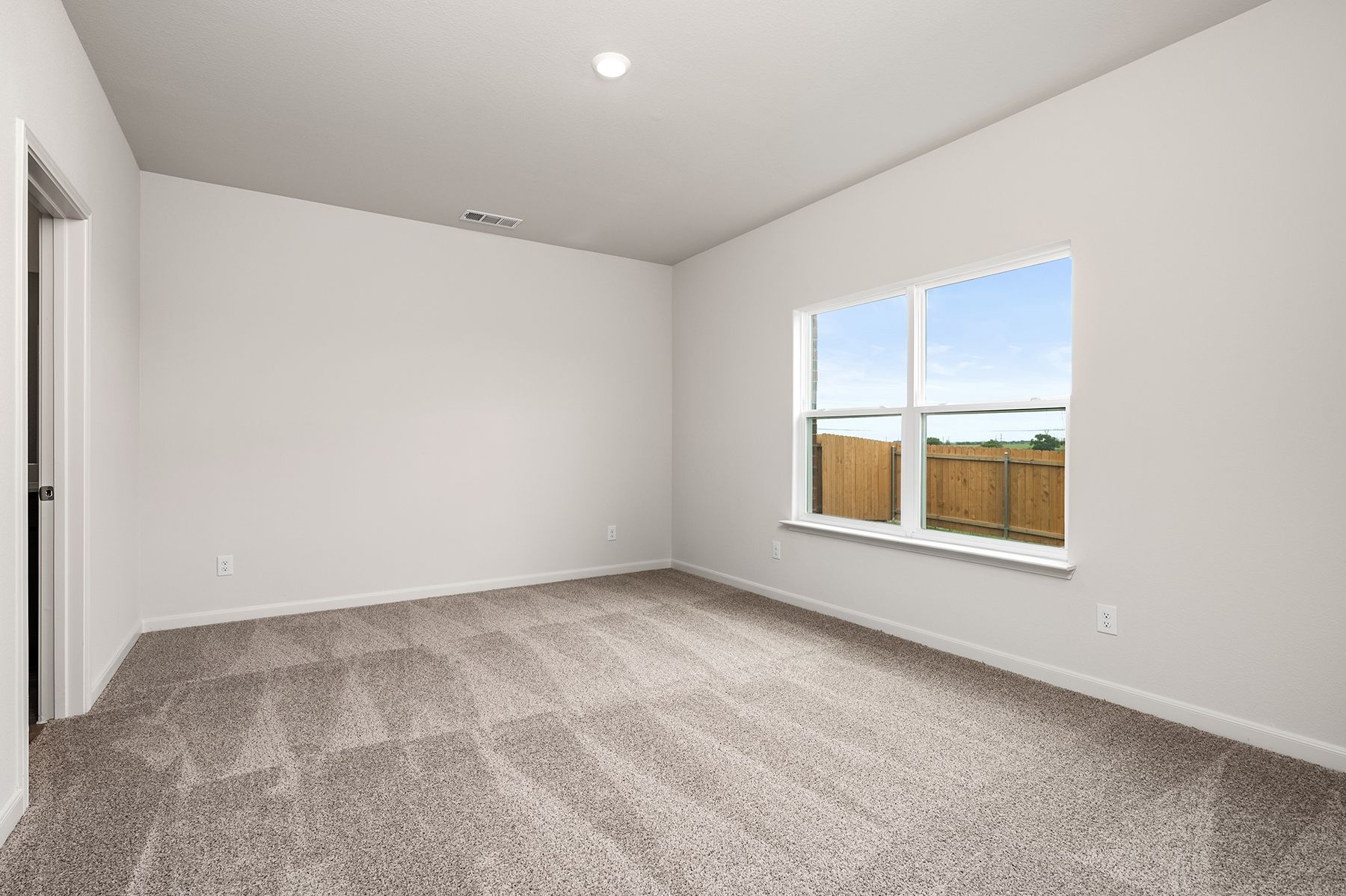 The master suite has a large bedroom, ensuite bathroom and a walk-in closet.