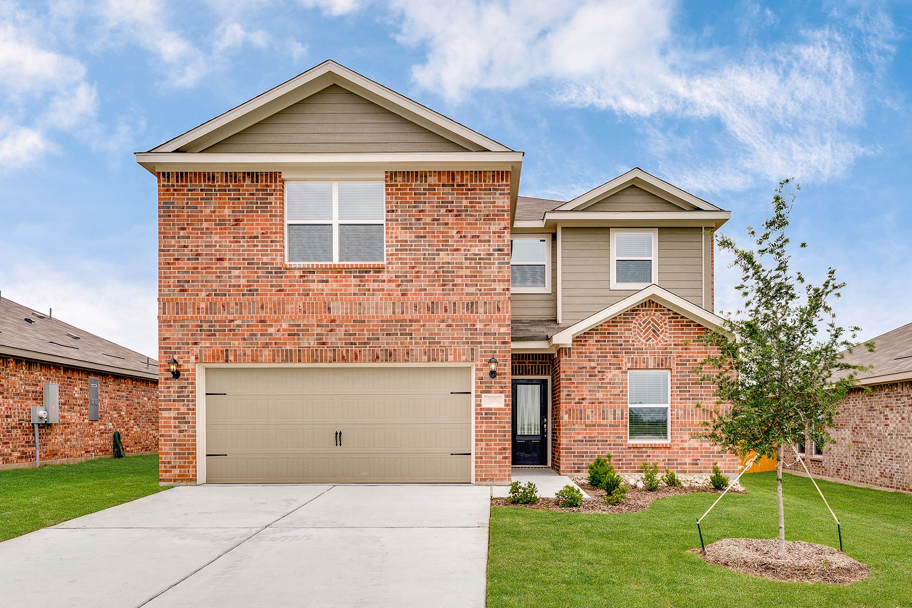The Cottonwood is a beautiful brick two-story home.