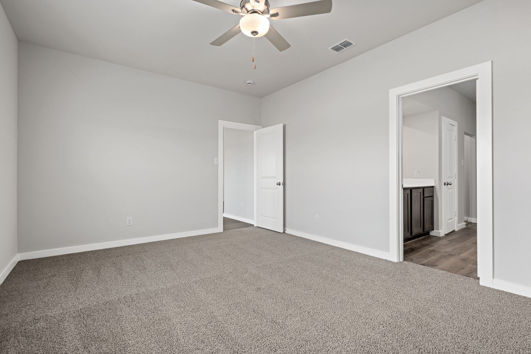 The master suite has a large bedroom, ensuite bathroom and a walk-in closet.