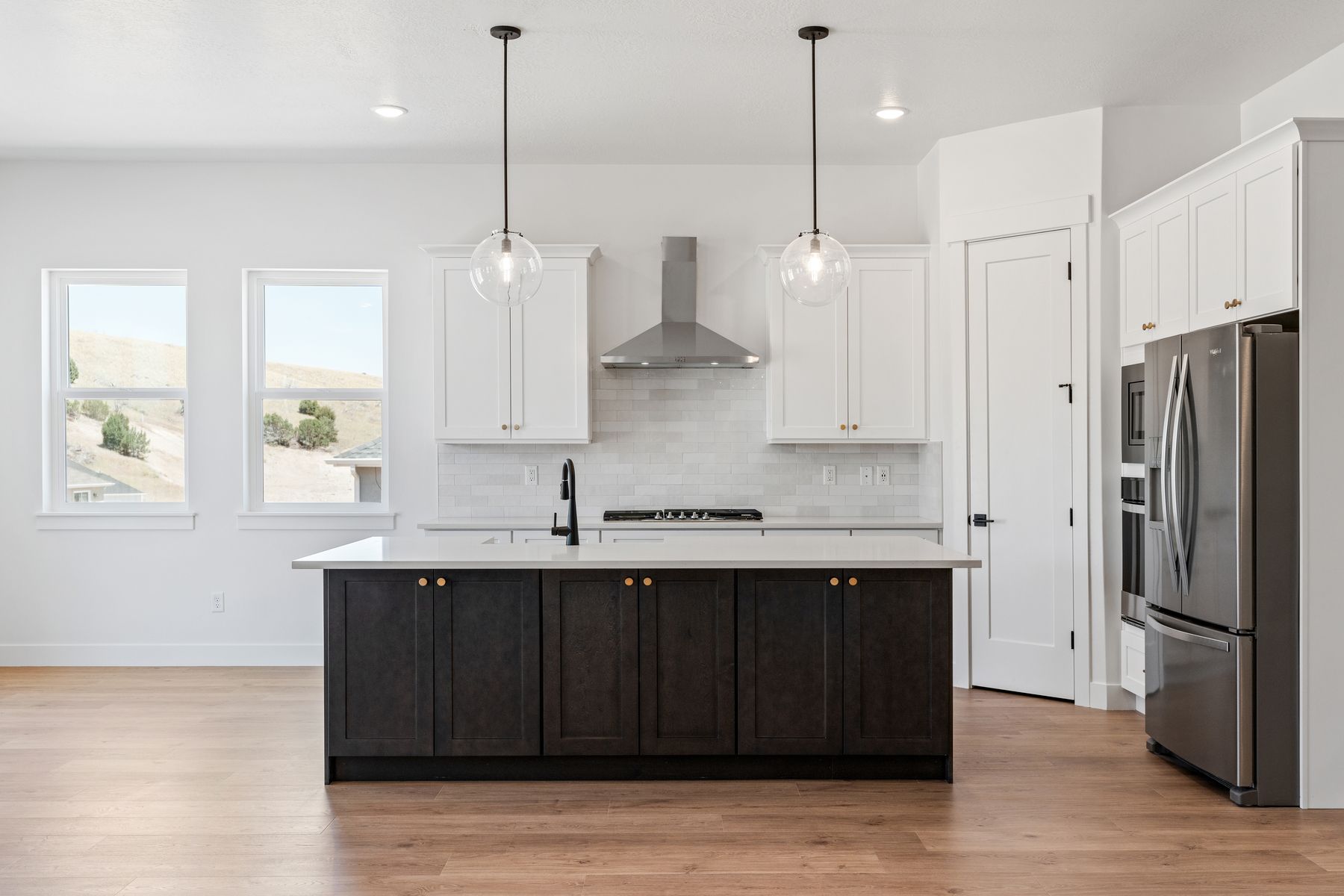 The kitchens have sprawling quartz countertops.