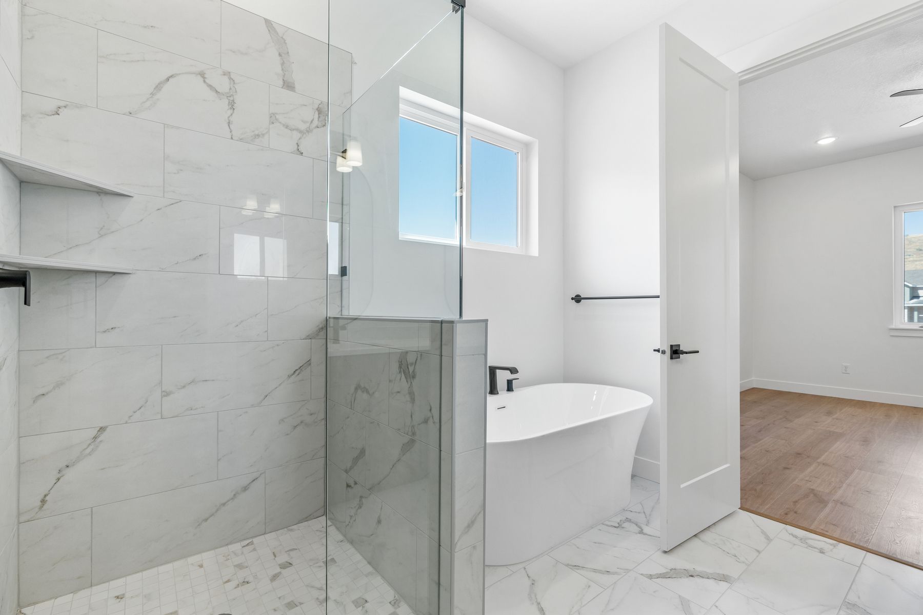 The master bathrooms have a glass, walk-in shower and soaker tub. 