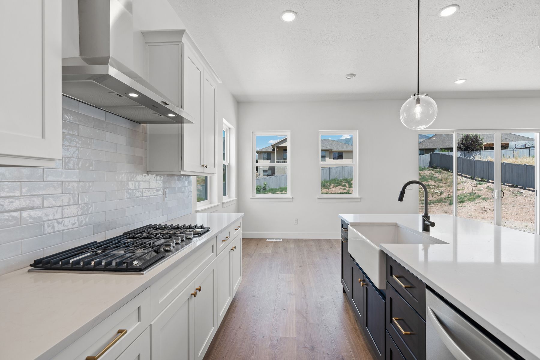 The kitchens have sprawling quartz countertops.