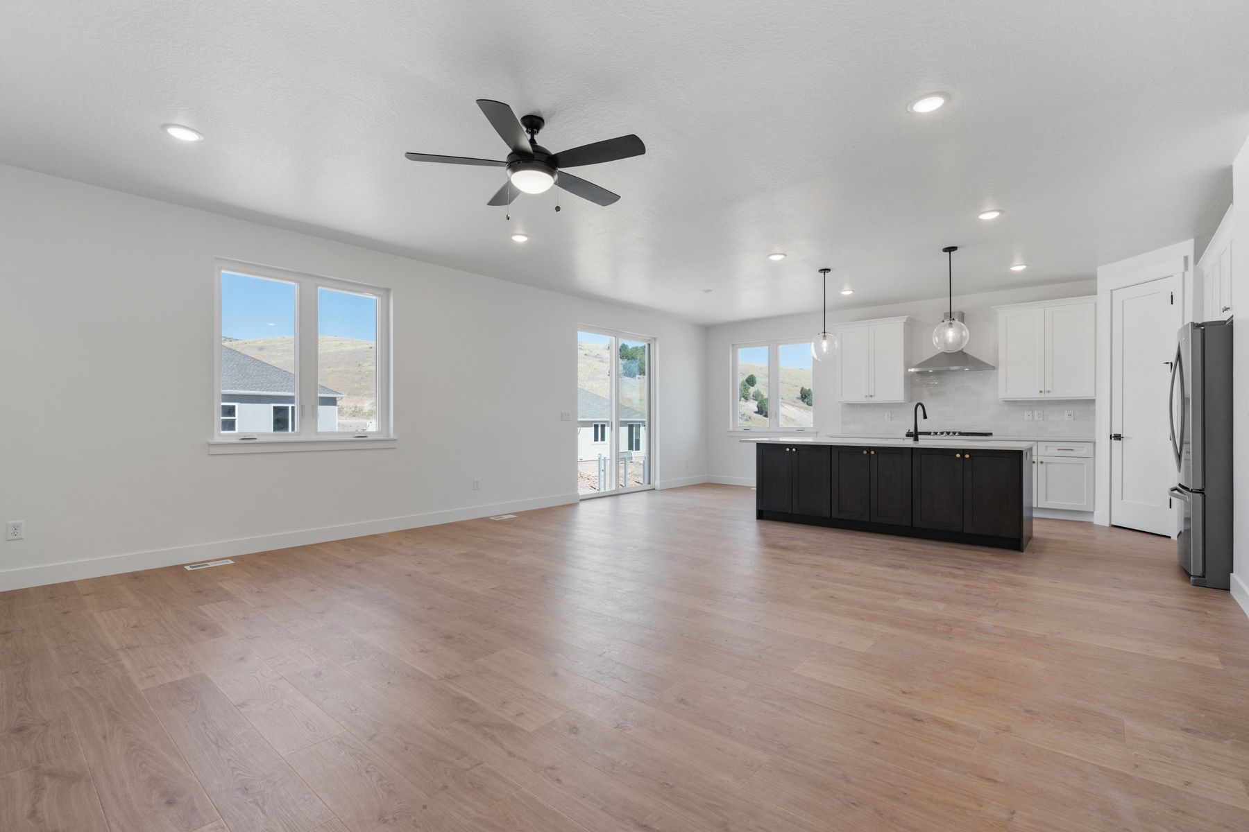 The family room is spacious and features large windows that let in great natural light.