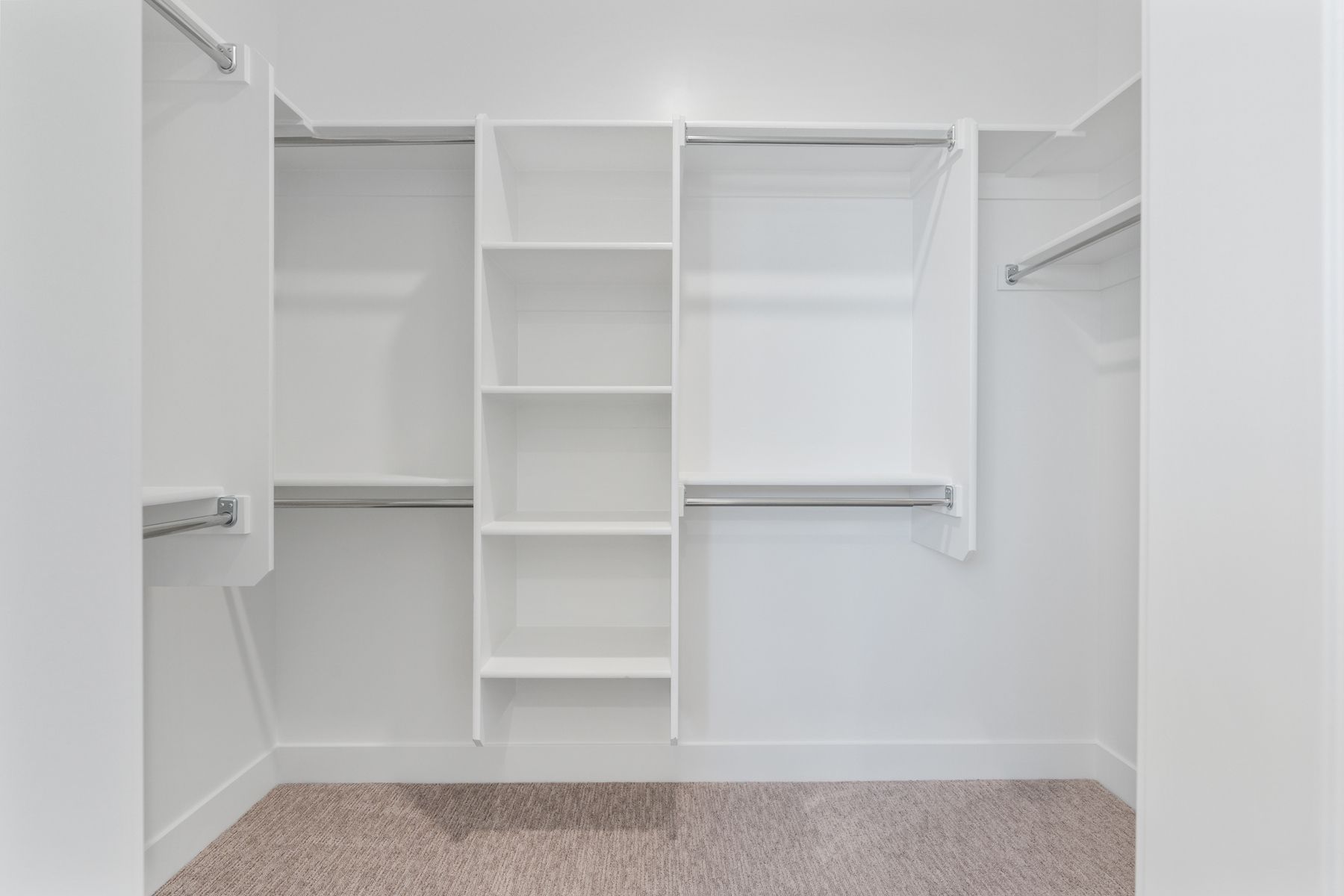 The master closet has plenty of hanging and shelf space.