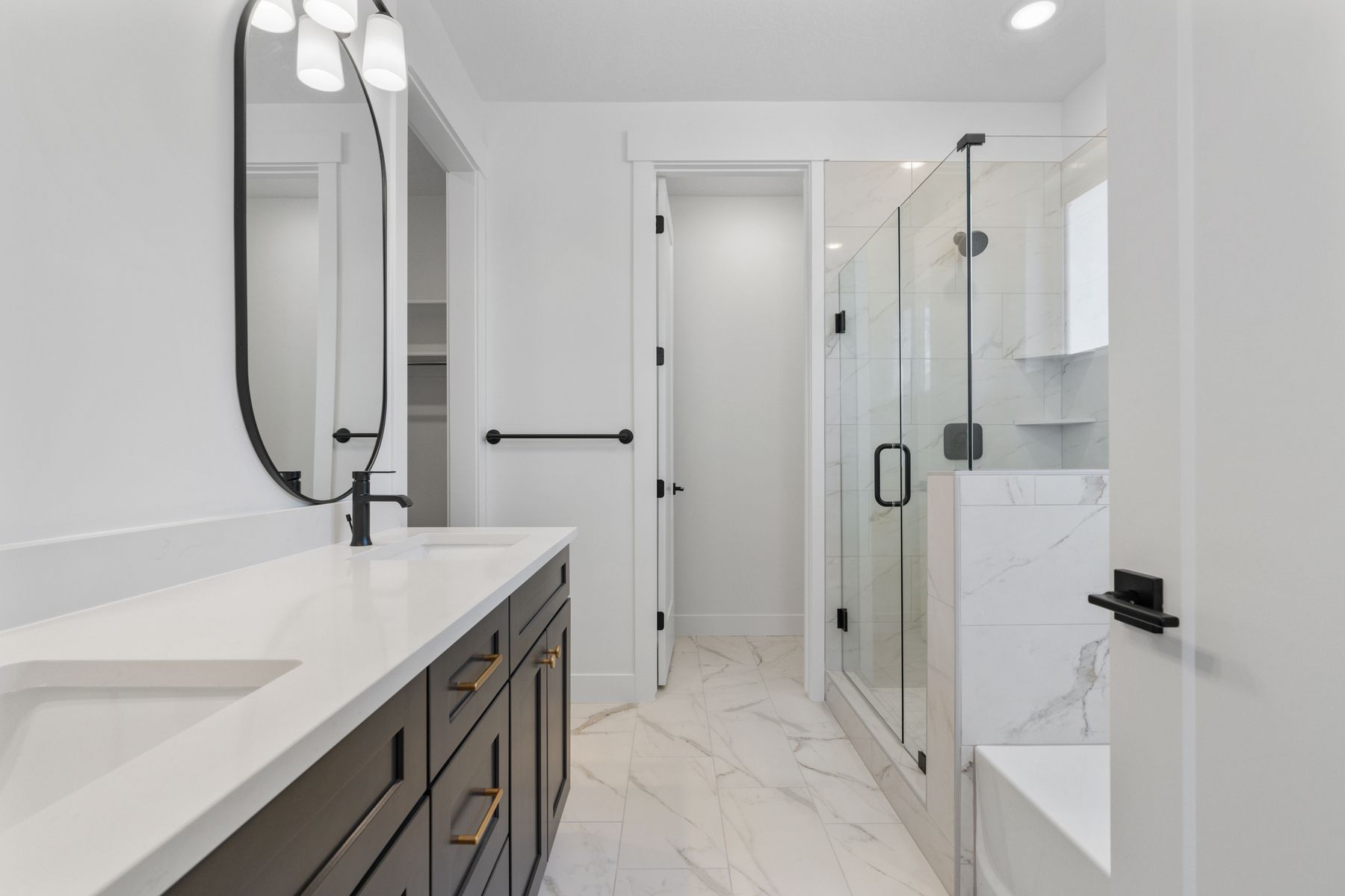 The master bathroom has a large vanity space with dual sinks.