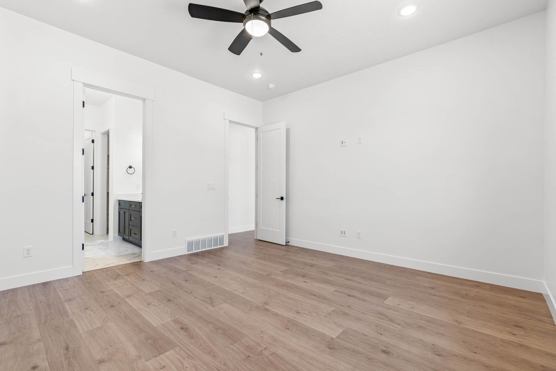 The master suite includes a large bedroom, en-suite bathroom and large walk-in closet.