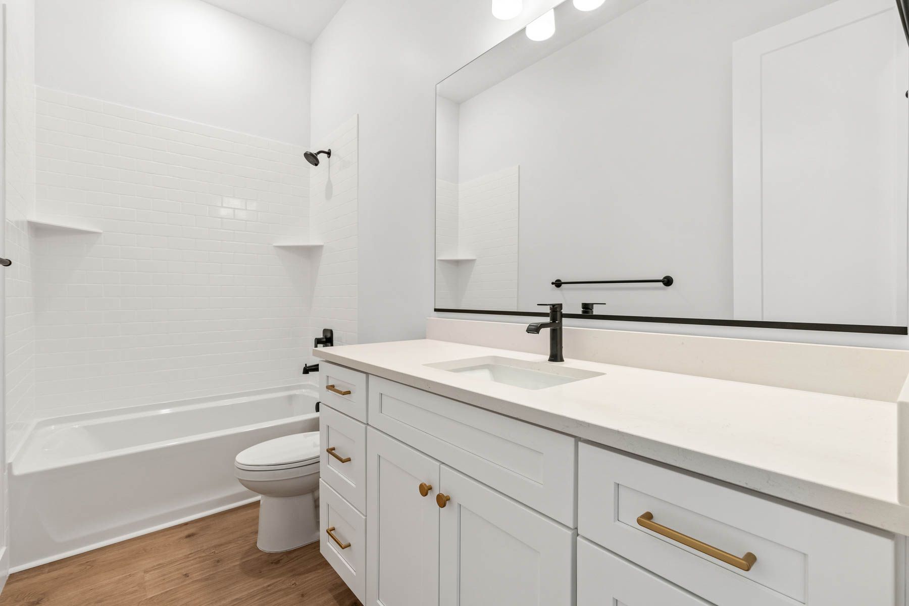The secondary bathroom has a large vanity space.