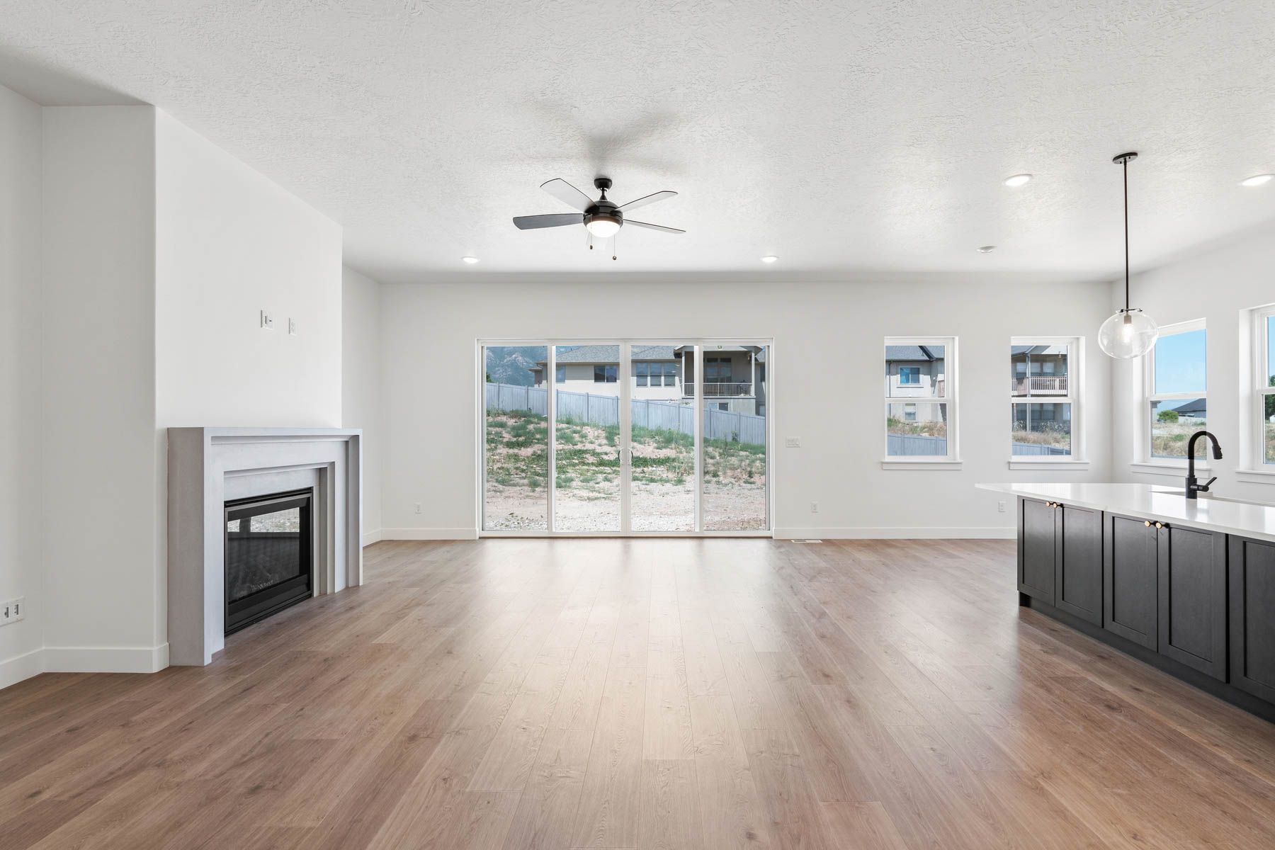 The family room is large and has lots of windows and a gas fireplace.