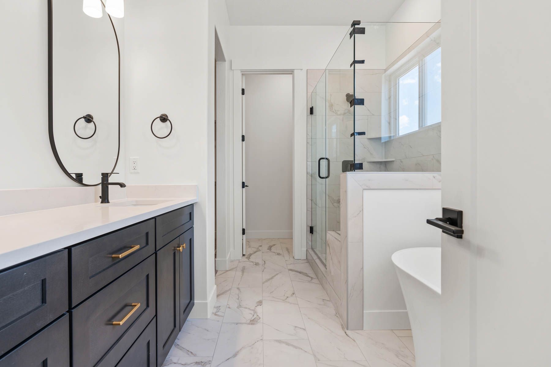 The master suite includes a large bedroom, en-suite bathroom and large walk-in closet.