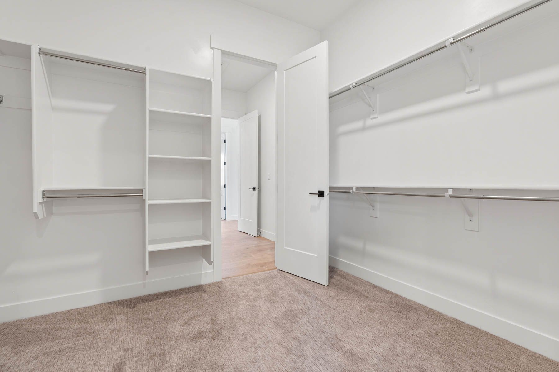 The master closet has plenty of hanging and shelf space.