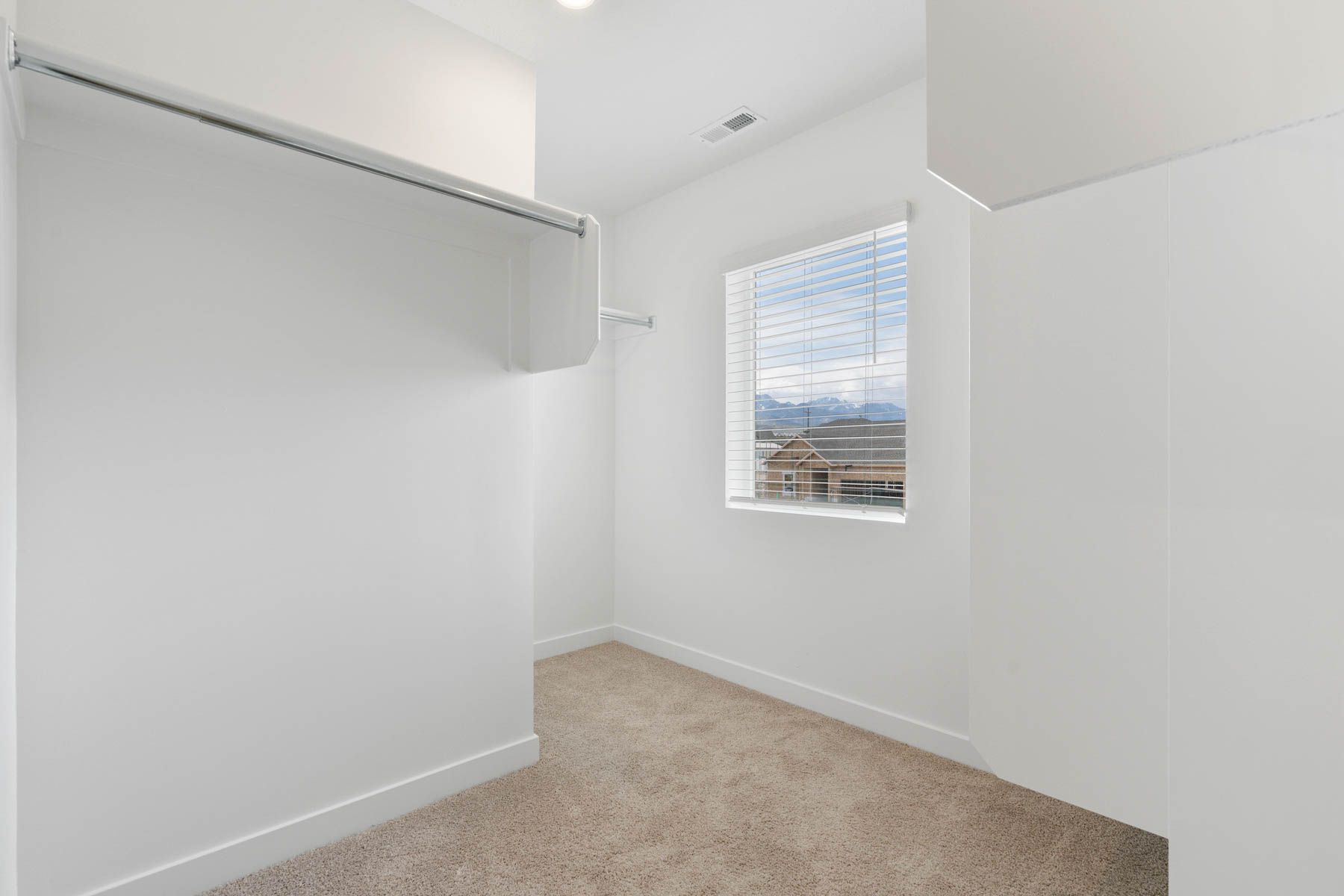 The master walk-in closet has plenty of space for clothes, shoes and personal belongings. 