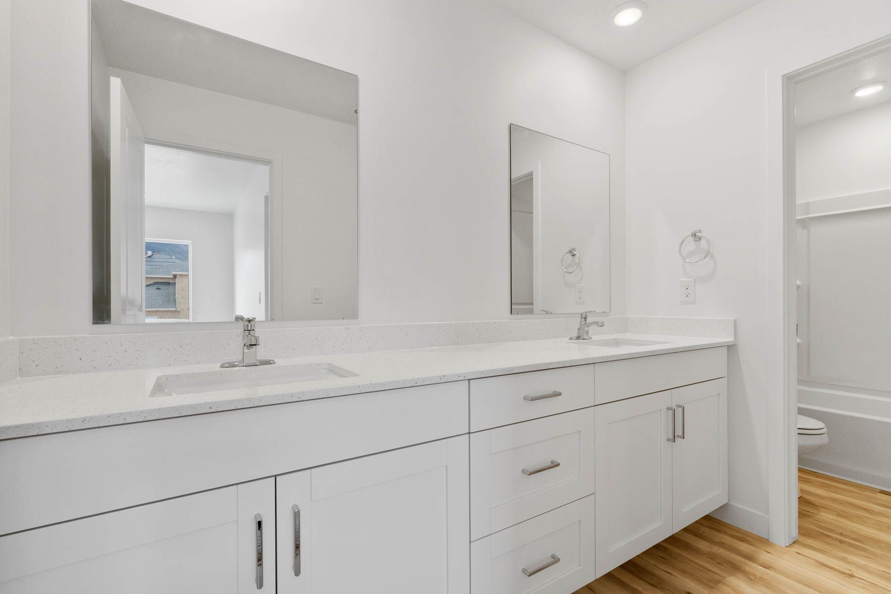 The secondary bathroom has a sprawling vanity.