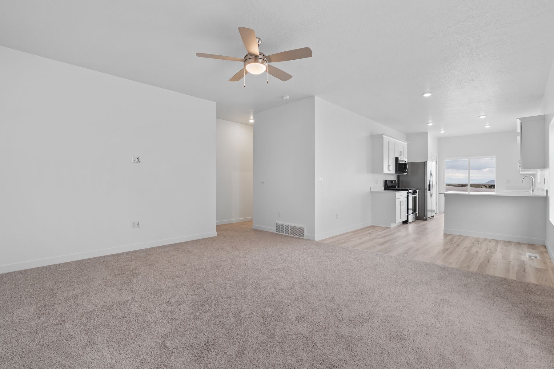 The living room sits right off of the dining room.