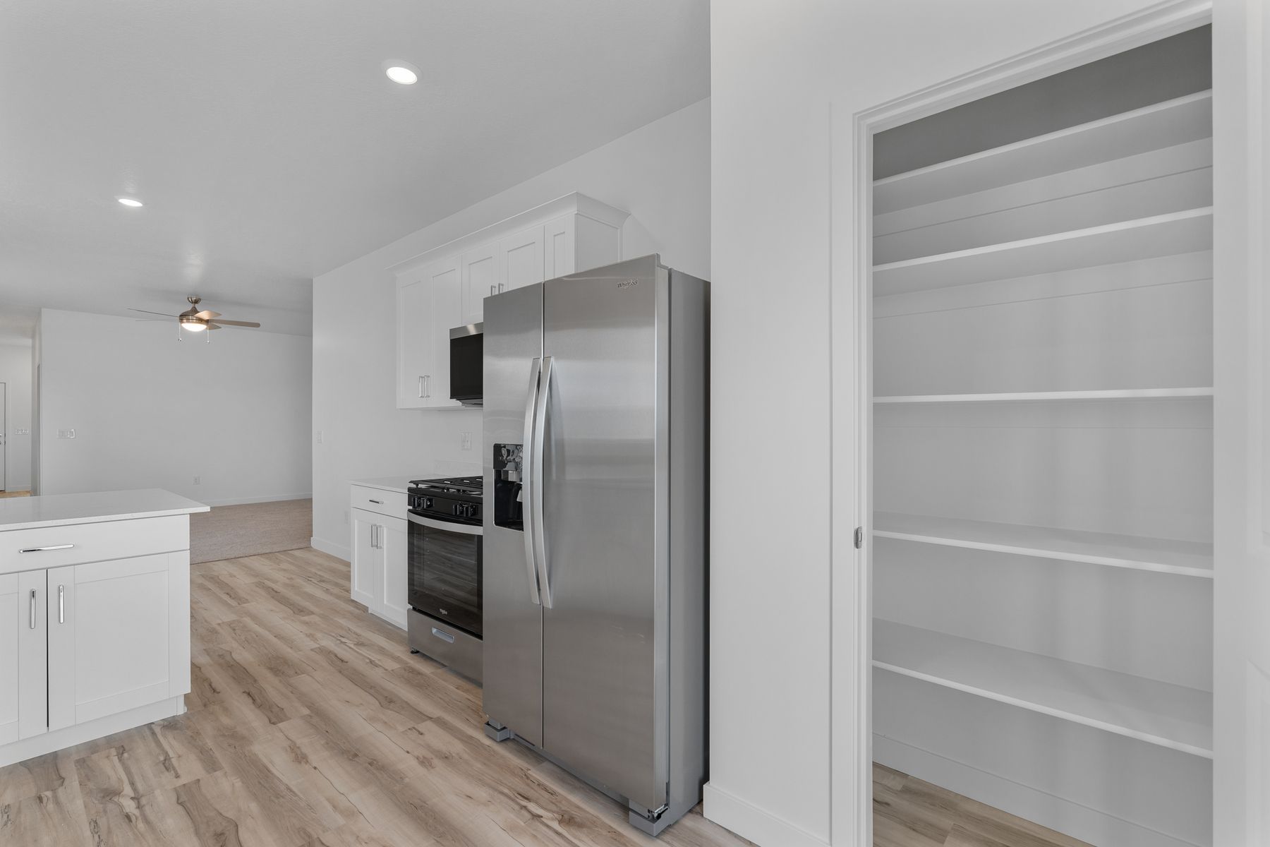 The kitchen has a pantry for additional kitchen storage. 