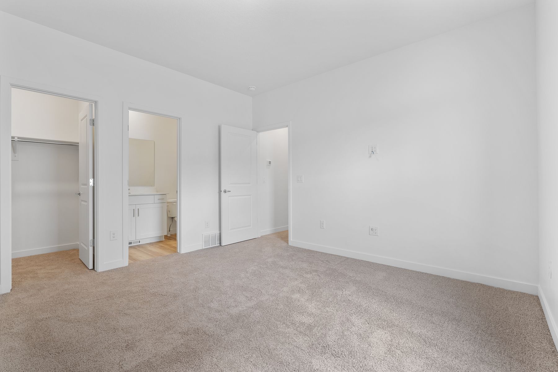 The master suite has a large bedroom, ensuite bathroom and a walk-in closet.