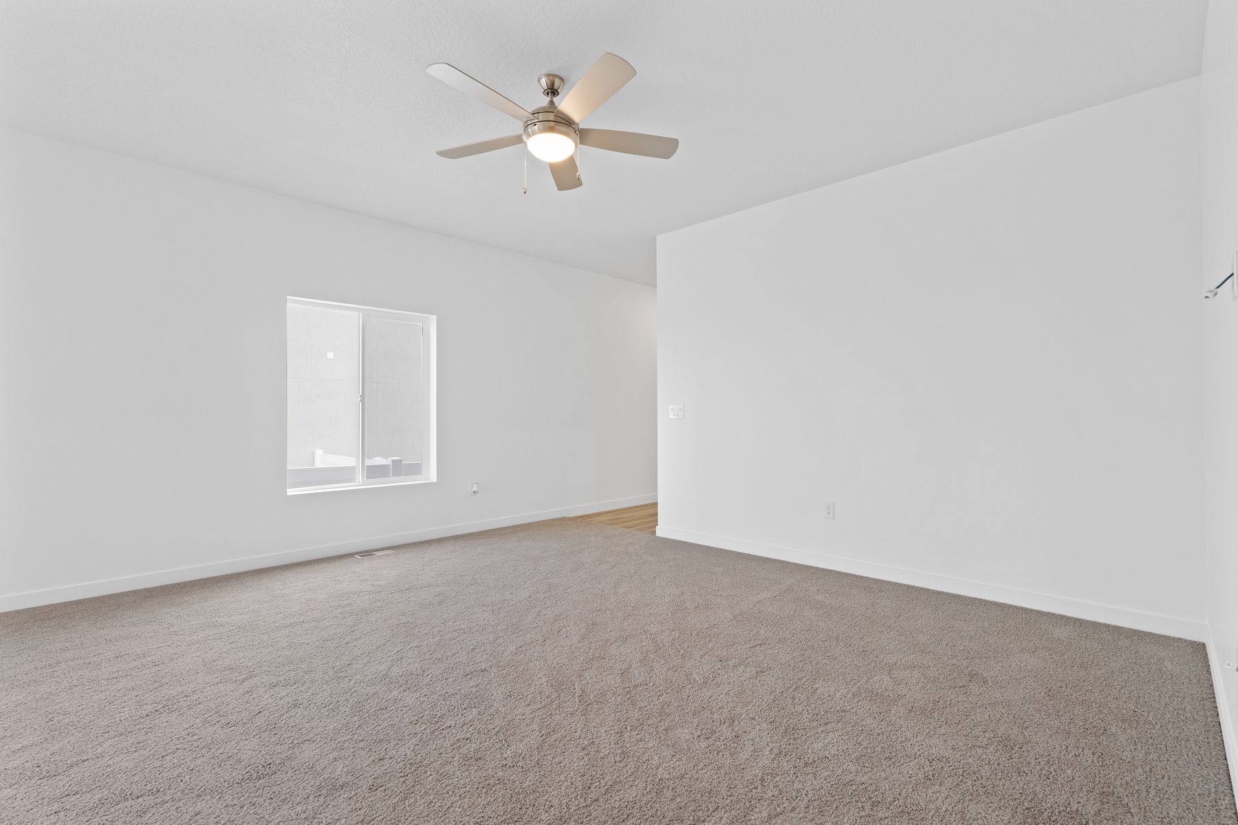 The family room is spacious for lots of furniture. 