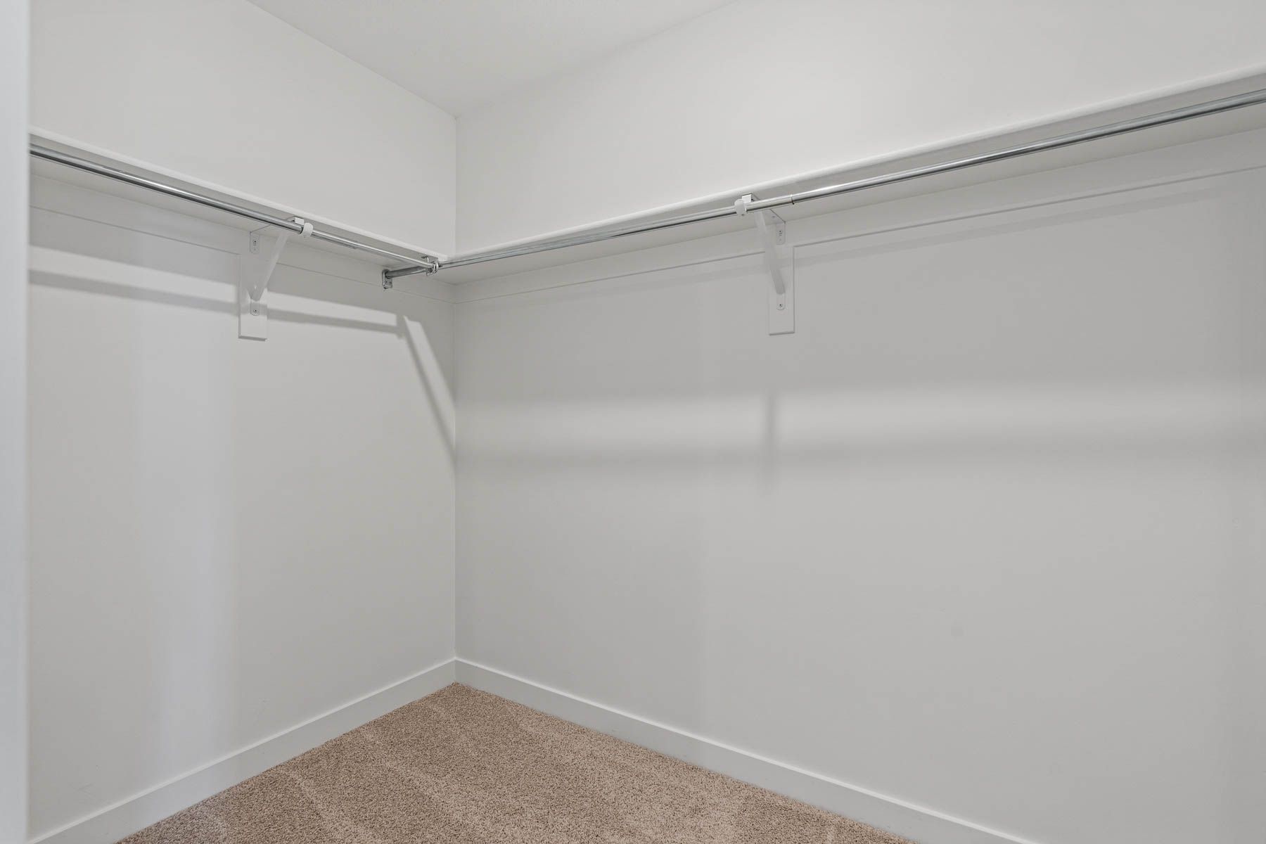 The walk-in closet is the perfect place to store clothes, shoes, and other personal belongings. 