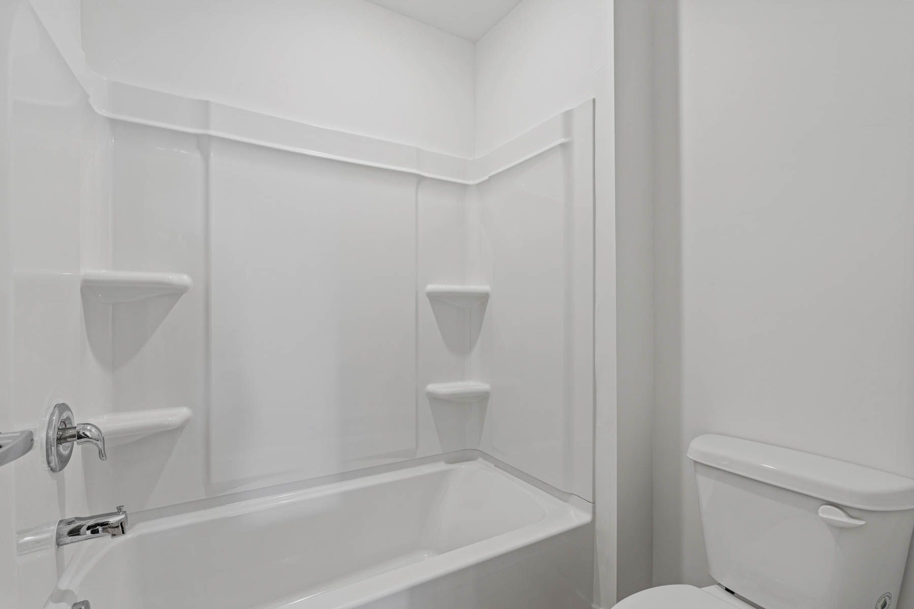 The secondary bathroom has a shower-tub combo.